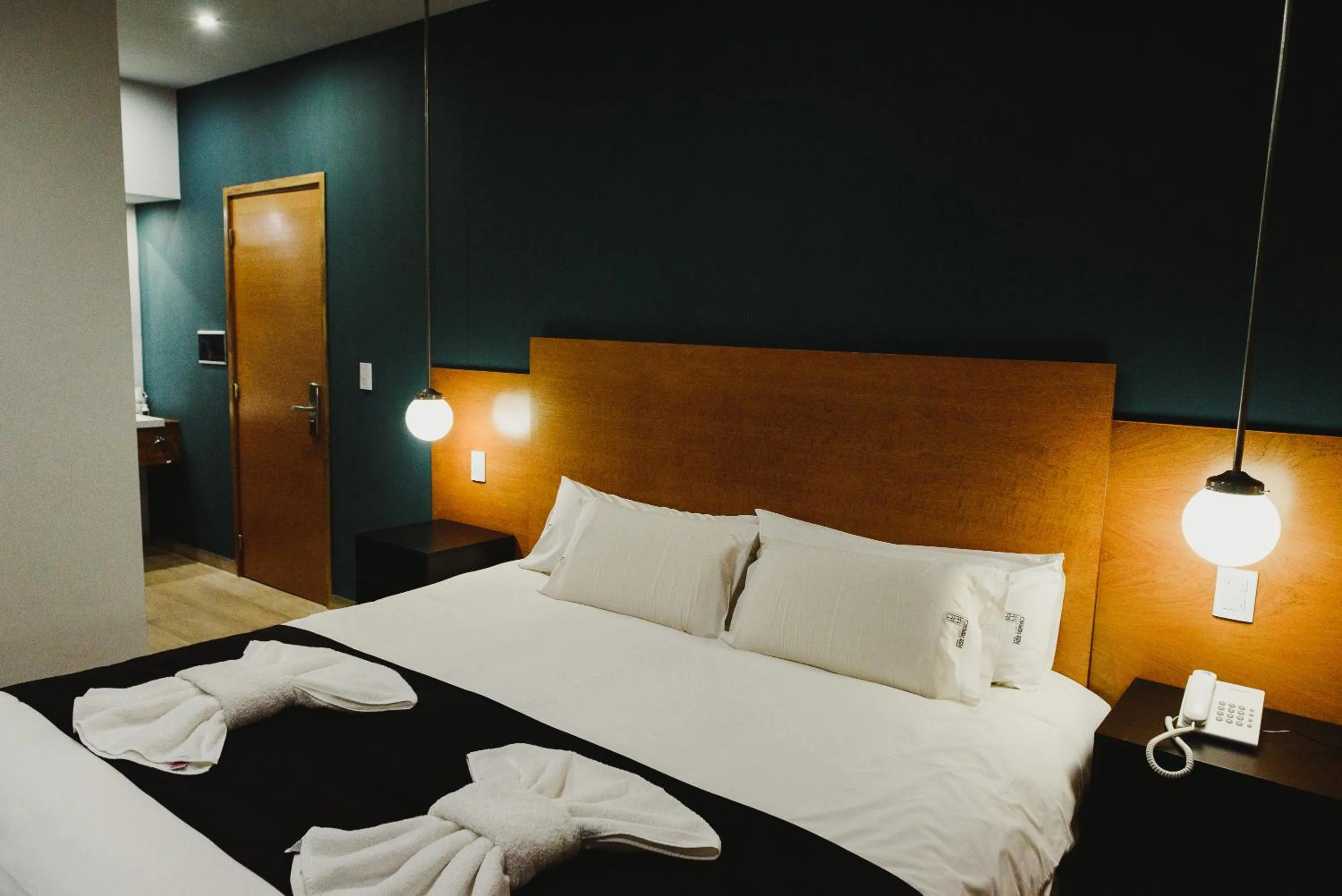 Bed in Plaza Paradiso Petit Hotel