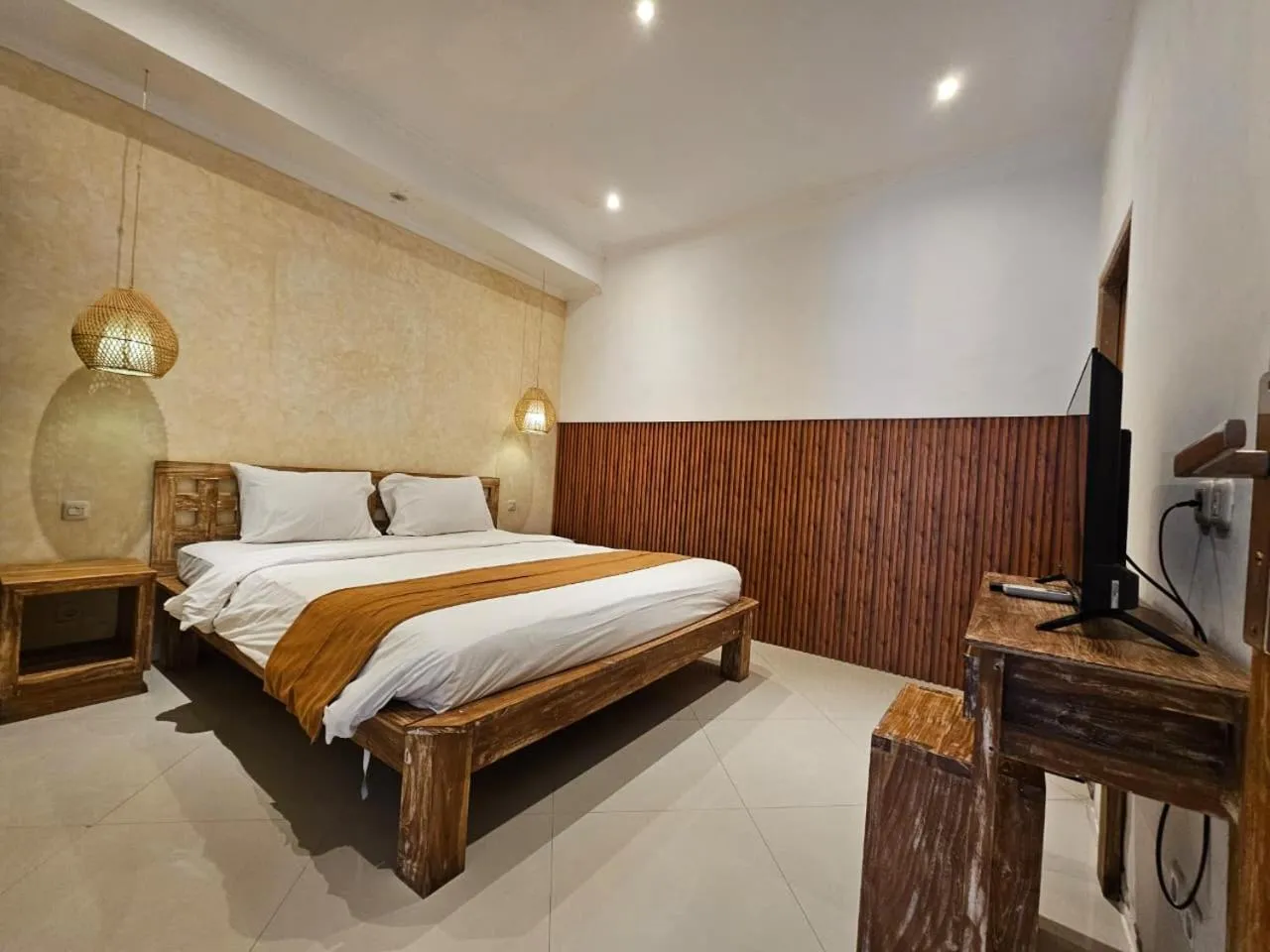Bed in Nipuri Resort and Villas Seminyak by Kamara