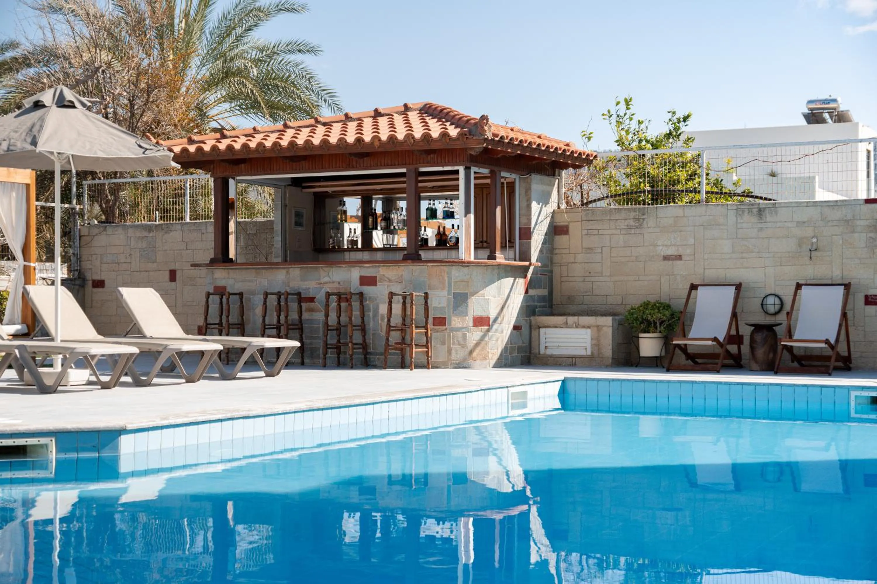 Swimming pool in Dimitra Hotel & Apartments by Omilos Hotels