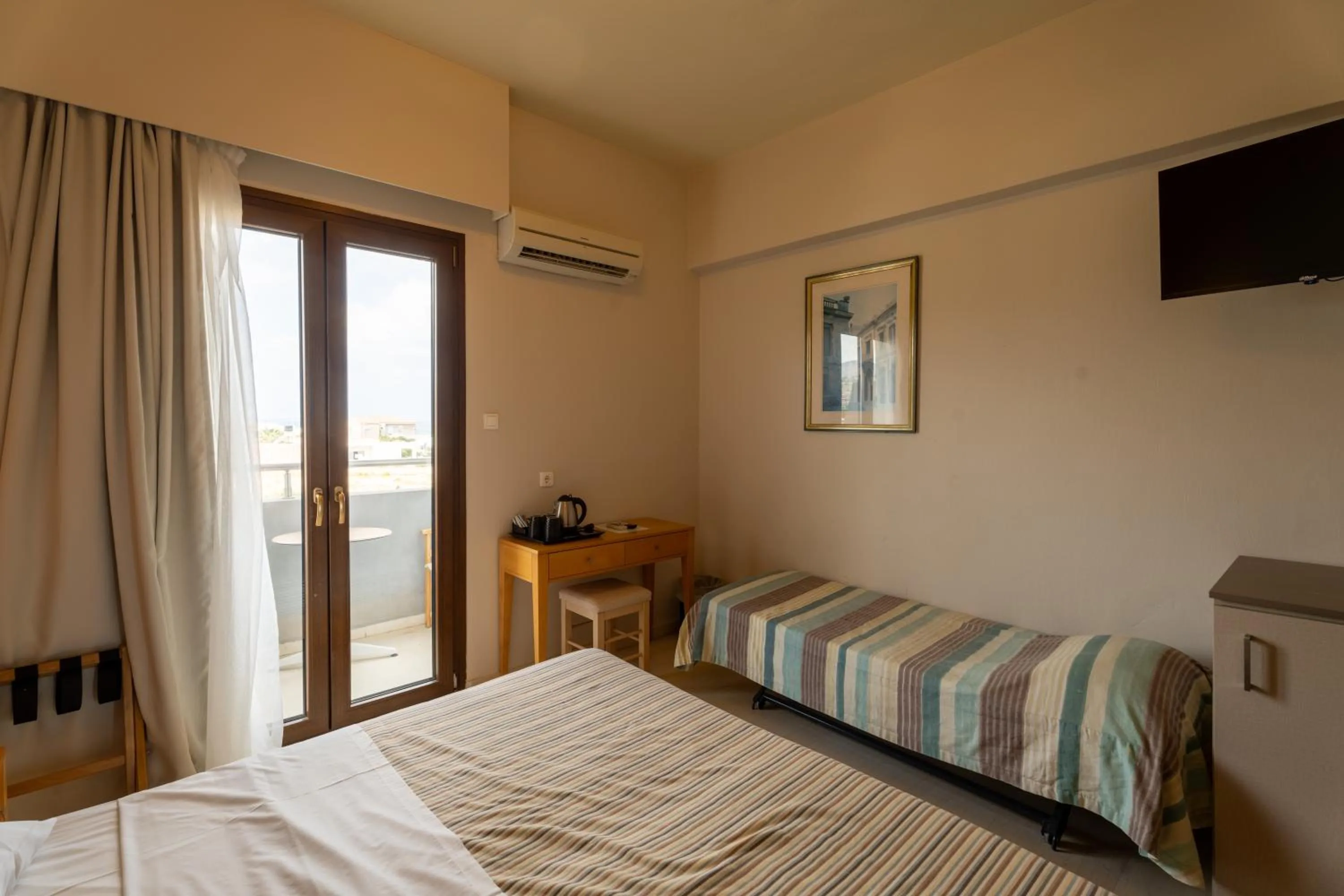 Bedroom, Bed in Dimitra Hotel & Apartments by Omilos Hotels