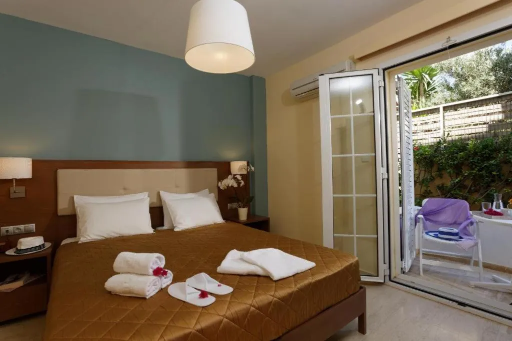 Bed in Dimitra Hotel & Apartments by Omilos Hotels