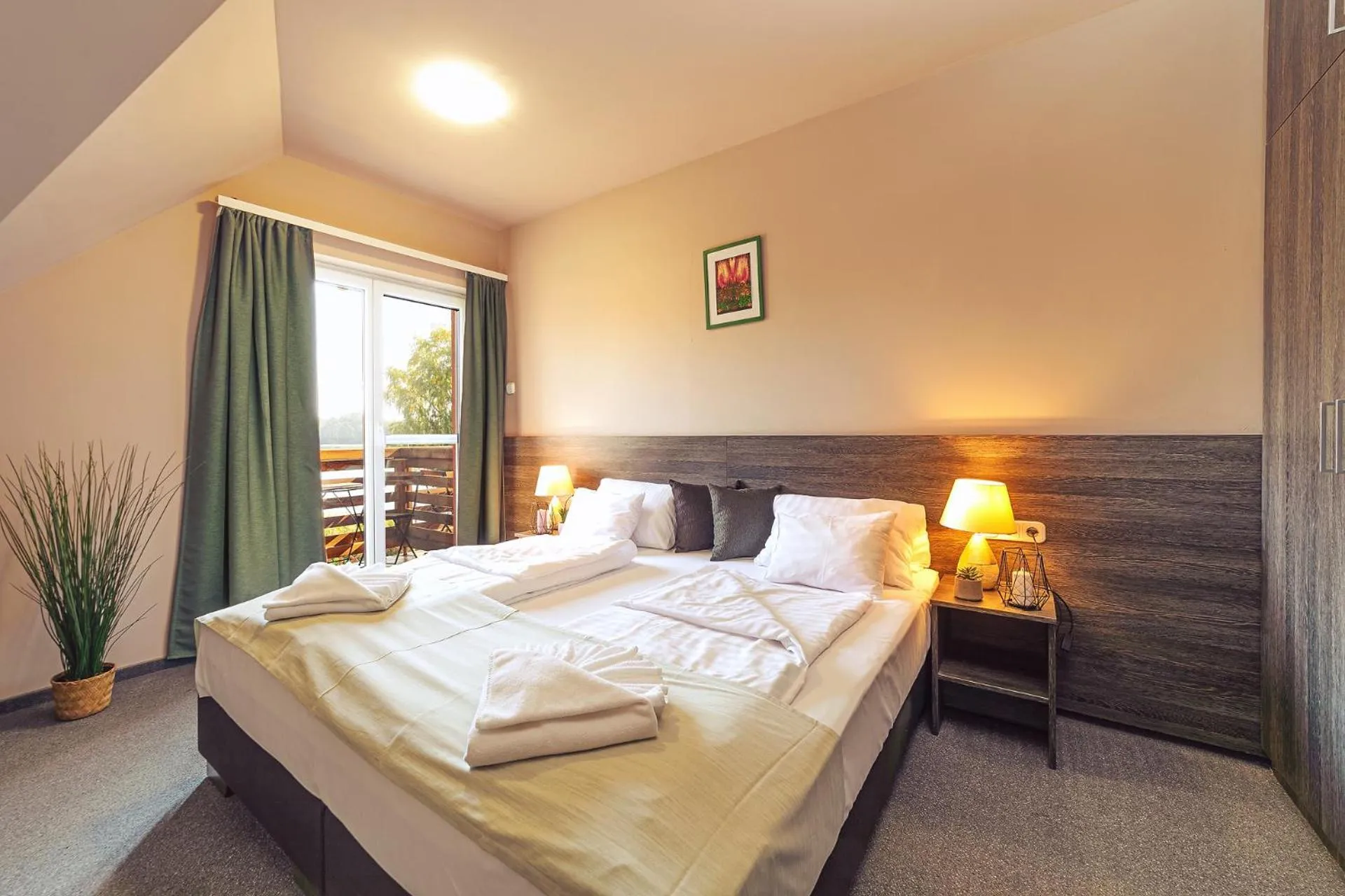 Bed in Mártoni Resort & Restaurant