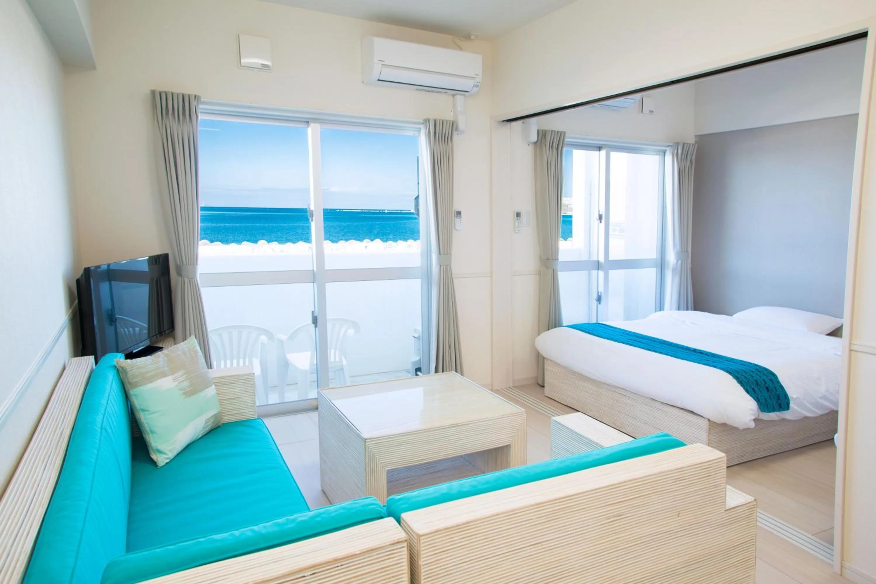 Living room, Bed in Costa Bella Condominium Resort