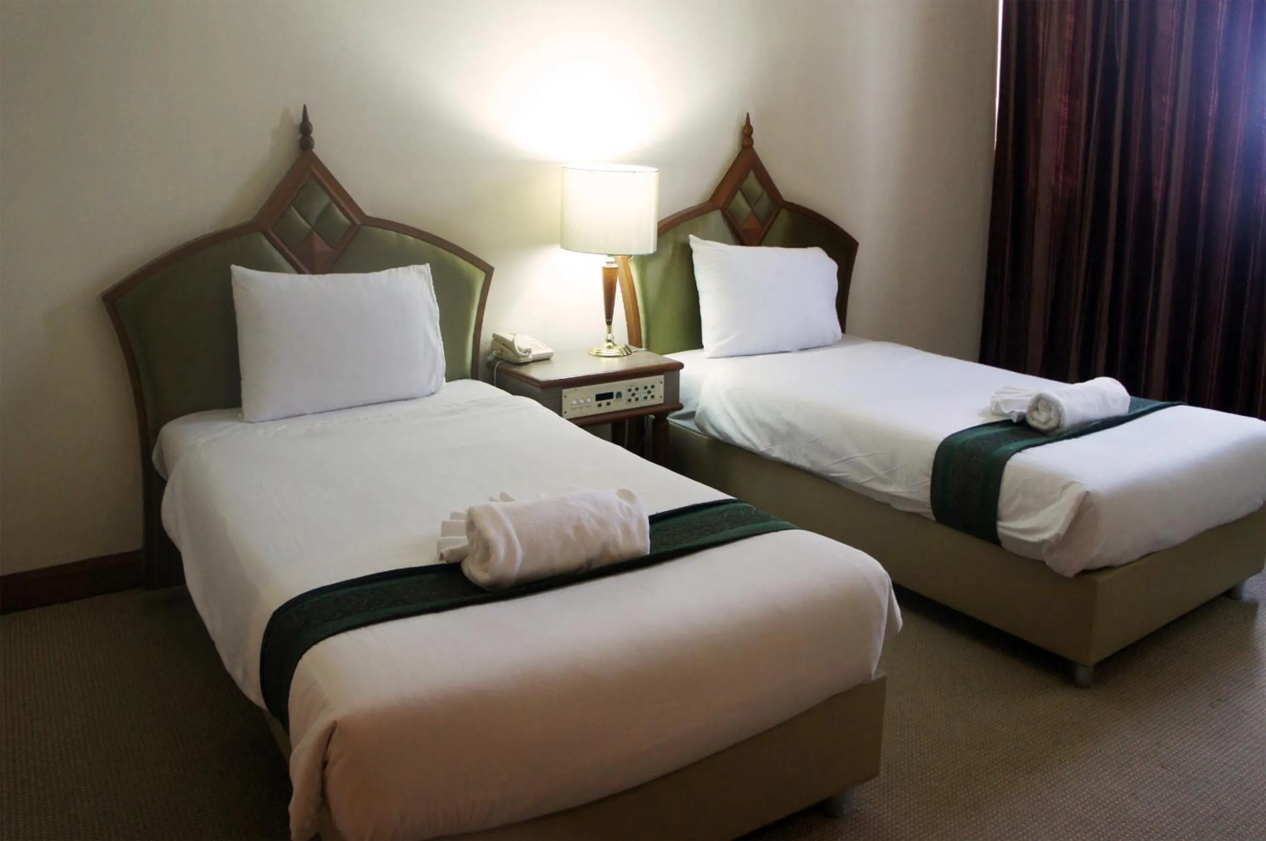 Bed in JP Emerald Hotel