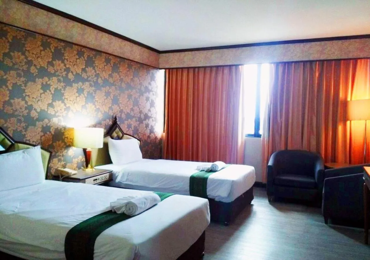 Bed in JP Emerald Hotel