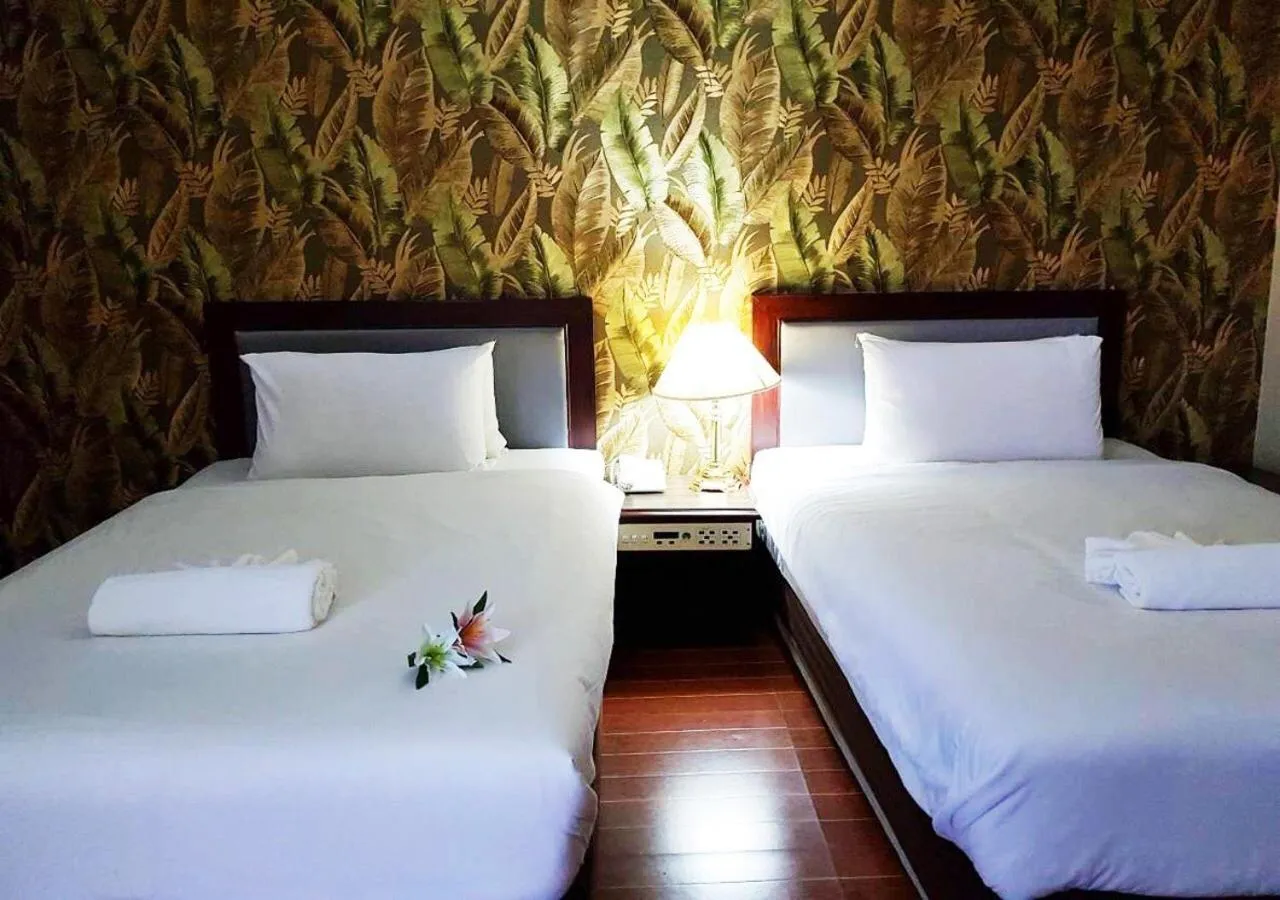 Bed in JP Emerald Hotel