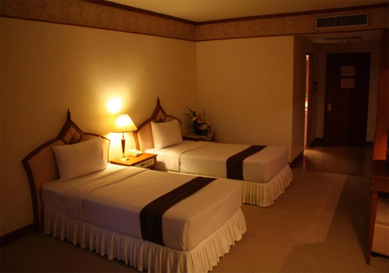 Bed in JP Emerald Hotel