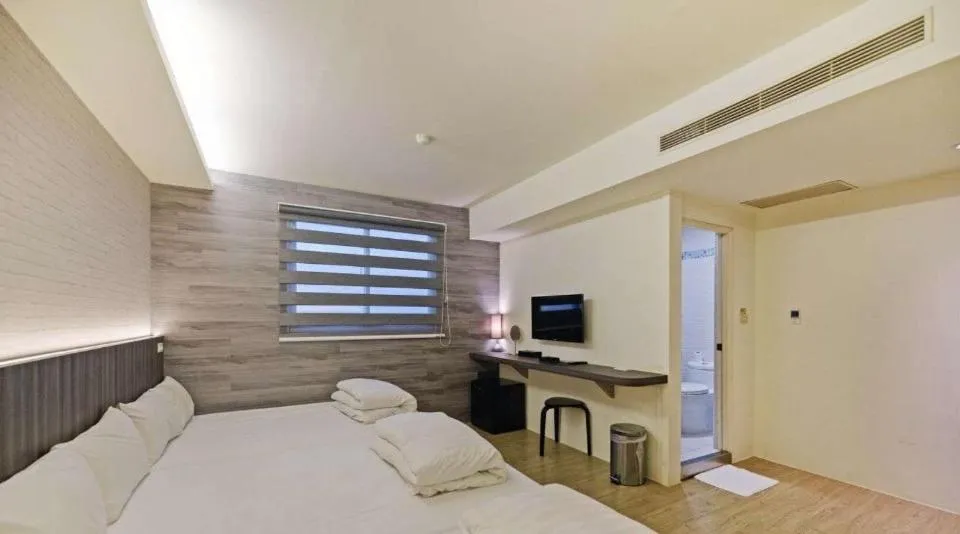 Photo of the whole room, Bed in Huaxin Hotel