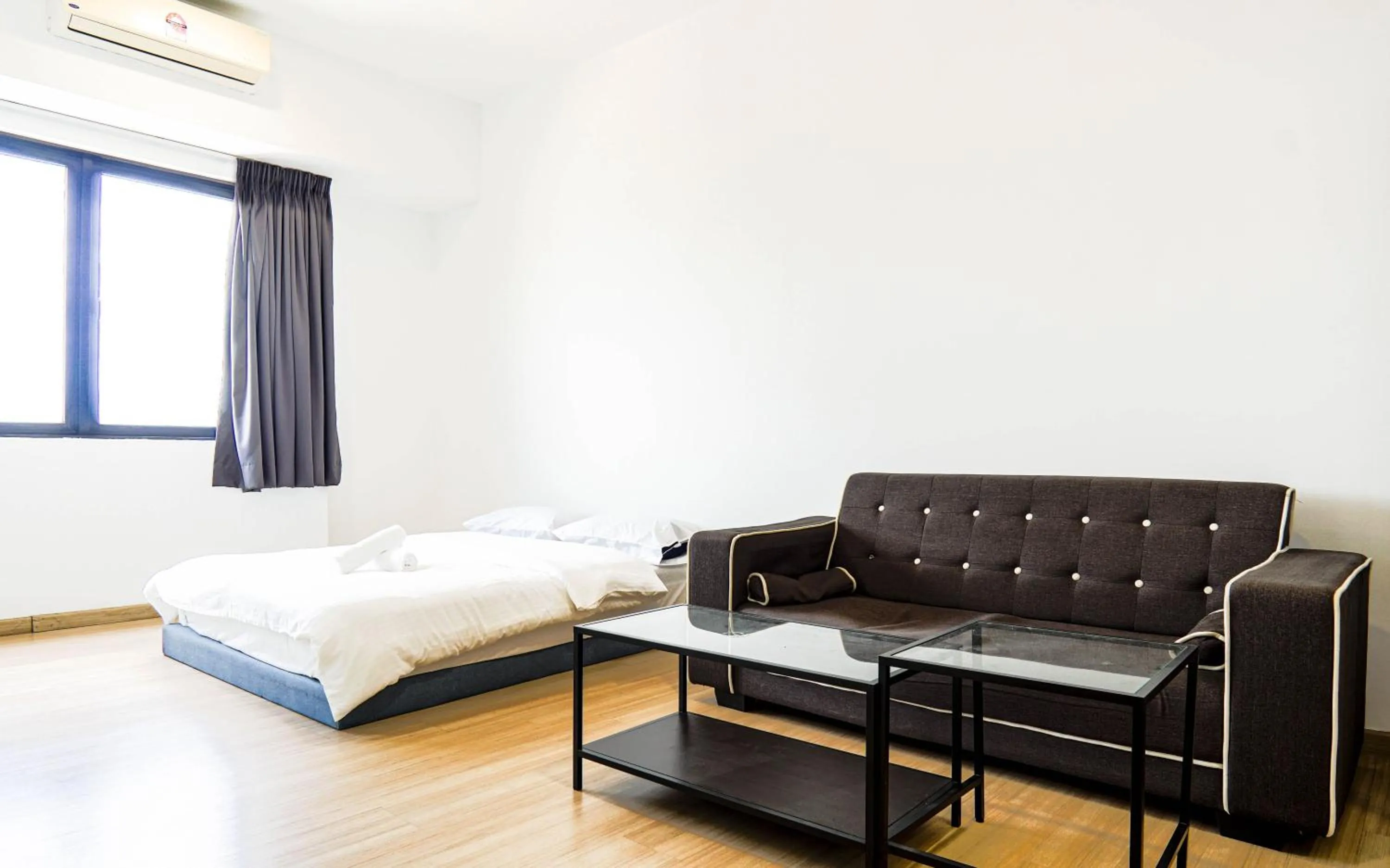 Living room, Bed in Encorp Strand Residences by Airhost