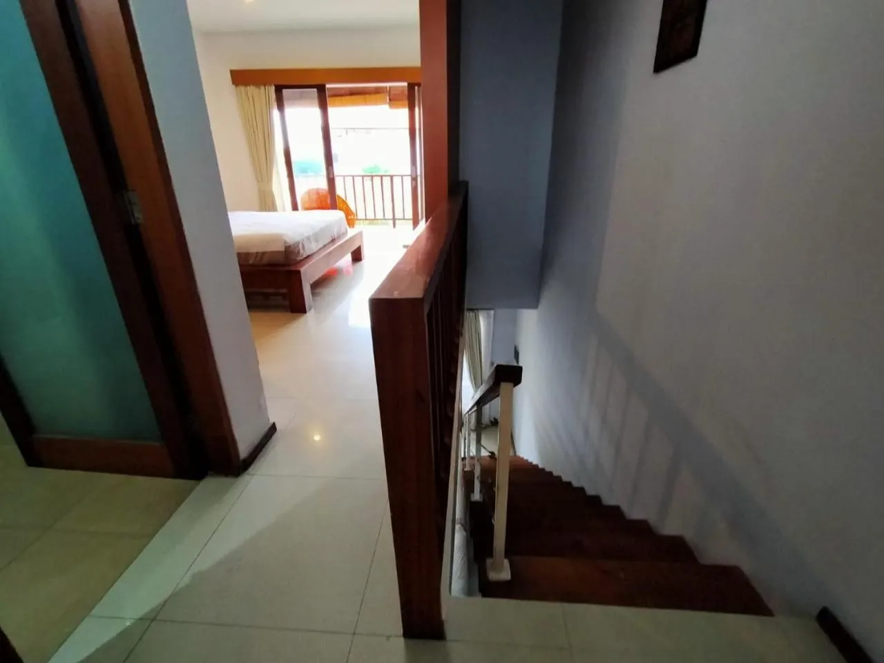 Bed in Balcony Living Apartment