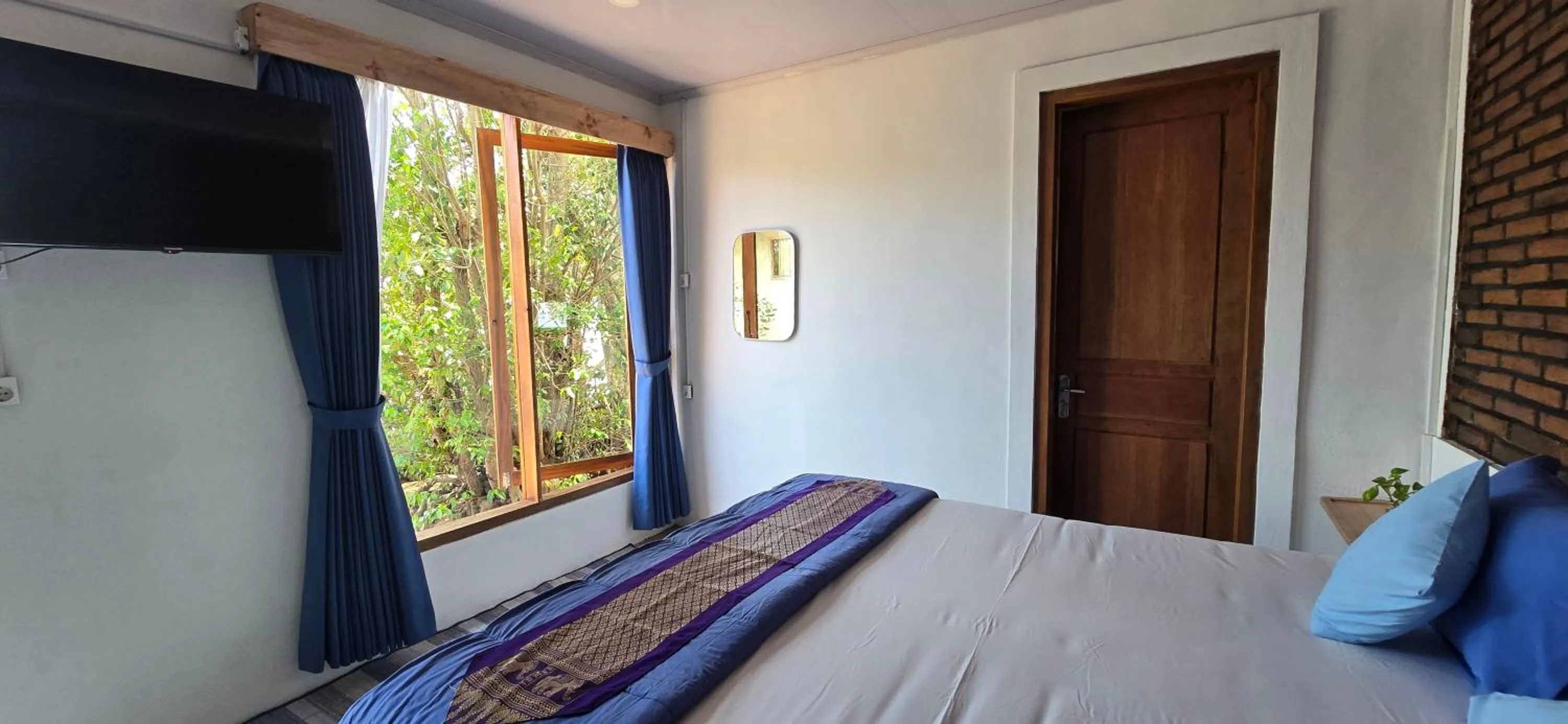 Bed in Omah Alchy Cottages