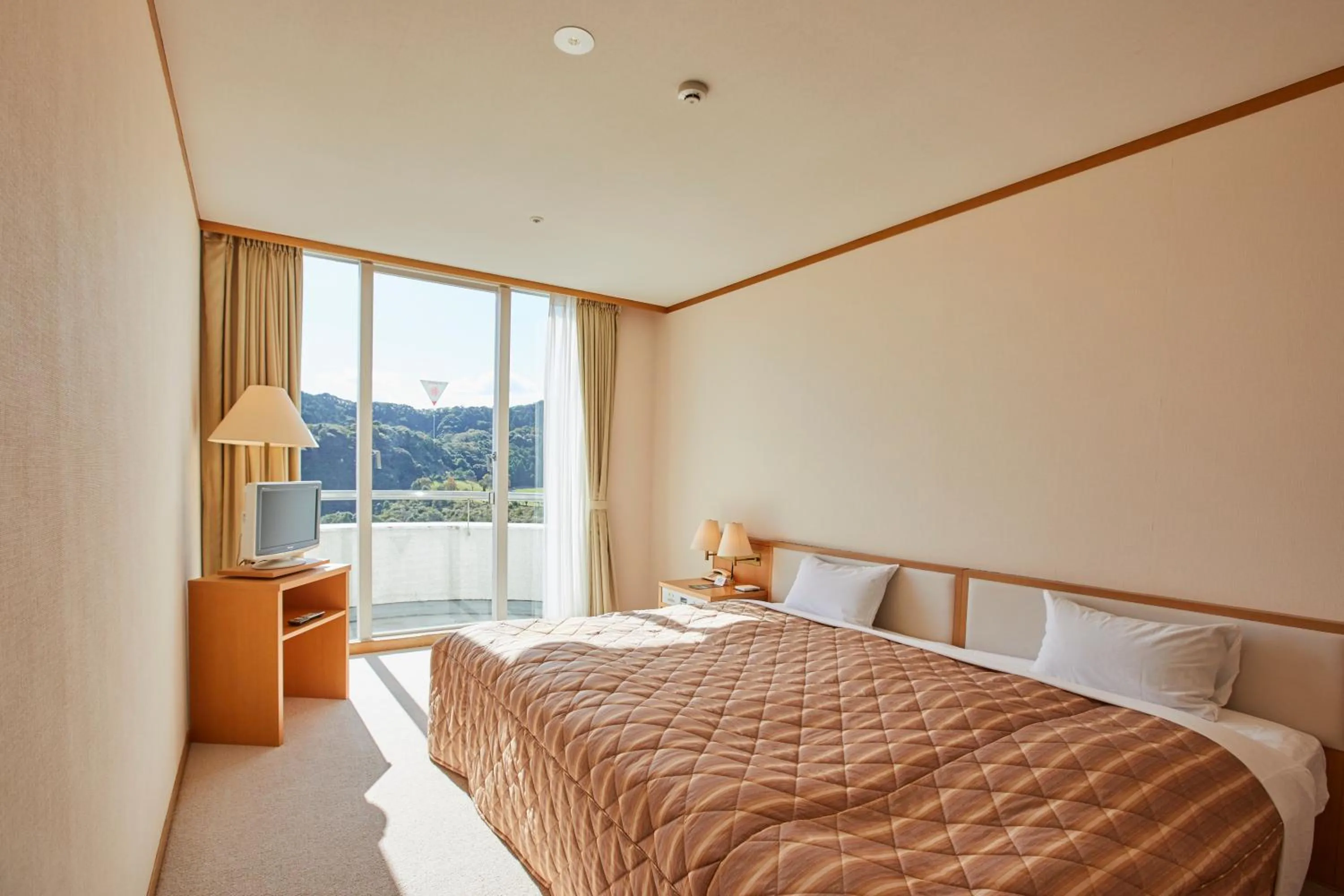 Bed in Kamogawa Country Hotel