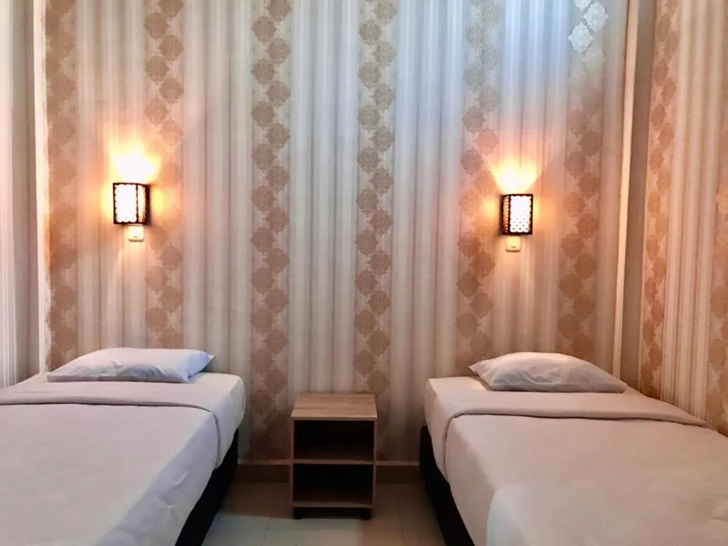 Bed in Penginapan Intan Bandara