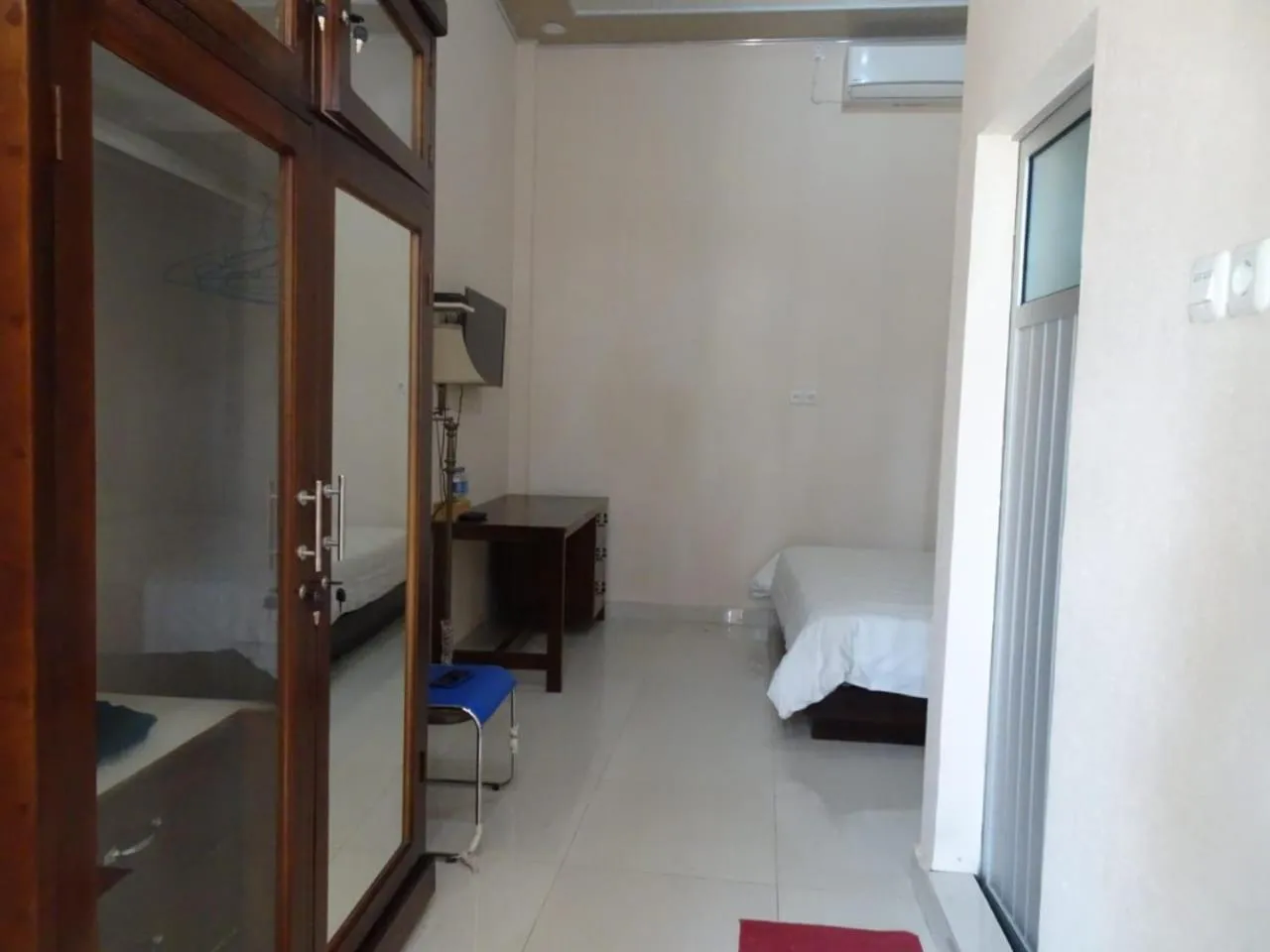 Bed in Penginapan Intan Bandara