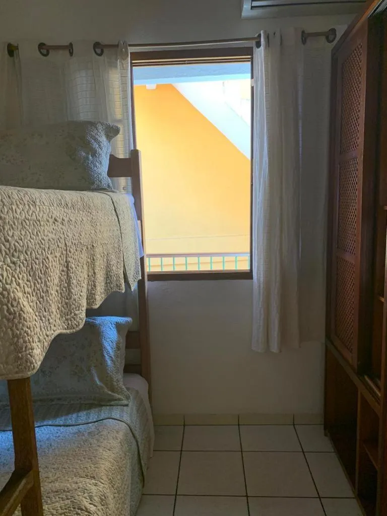 Bed in Pousada Irmãos do Mar