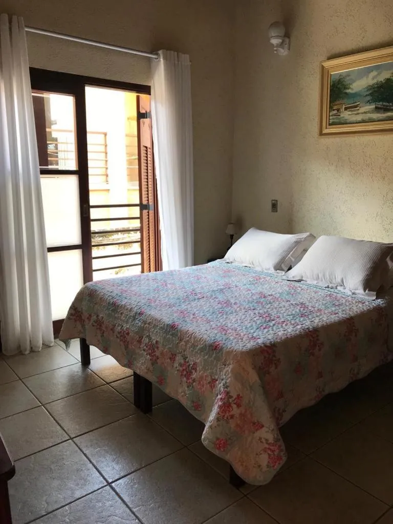 Bed in Pousada Irmãos do Mar