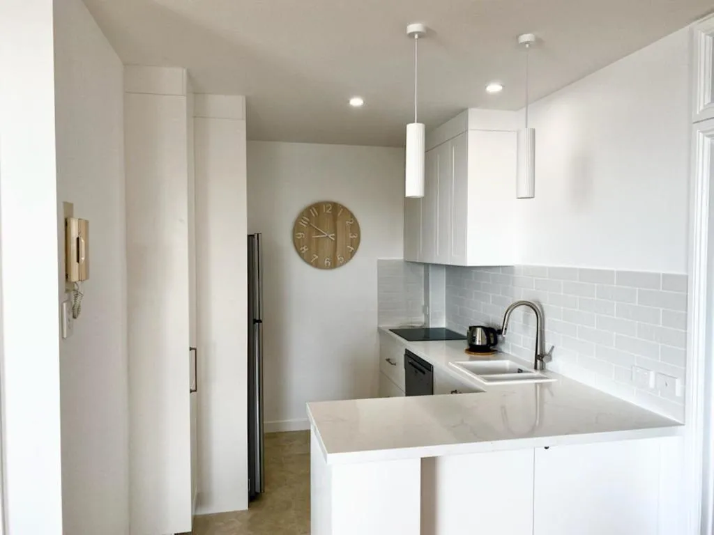Kitchen or kitchenette in Kings Row Apartments