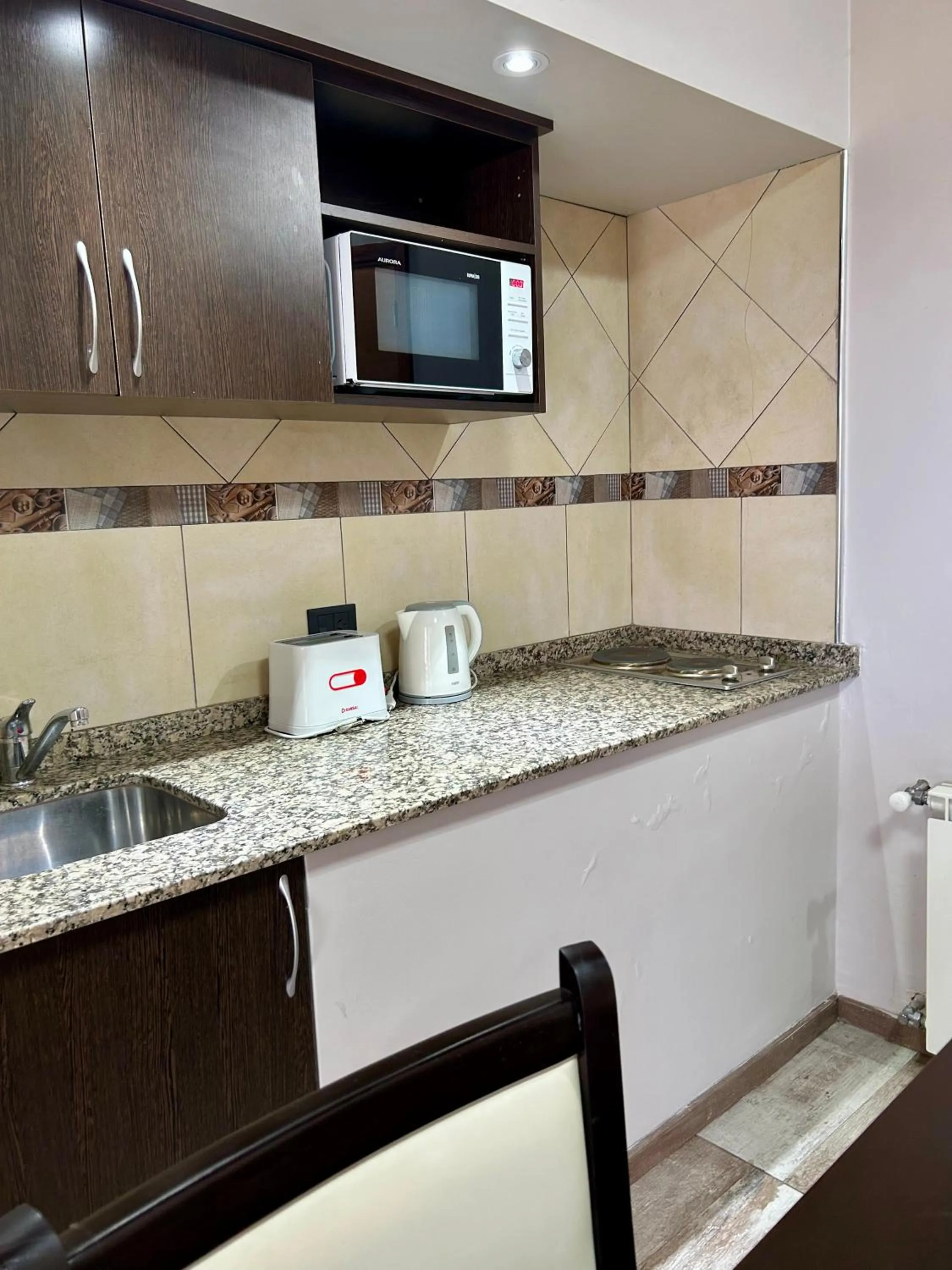 Kitchen or kitchenette in Bahia Paraiso Apart & Suites