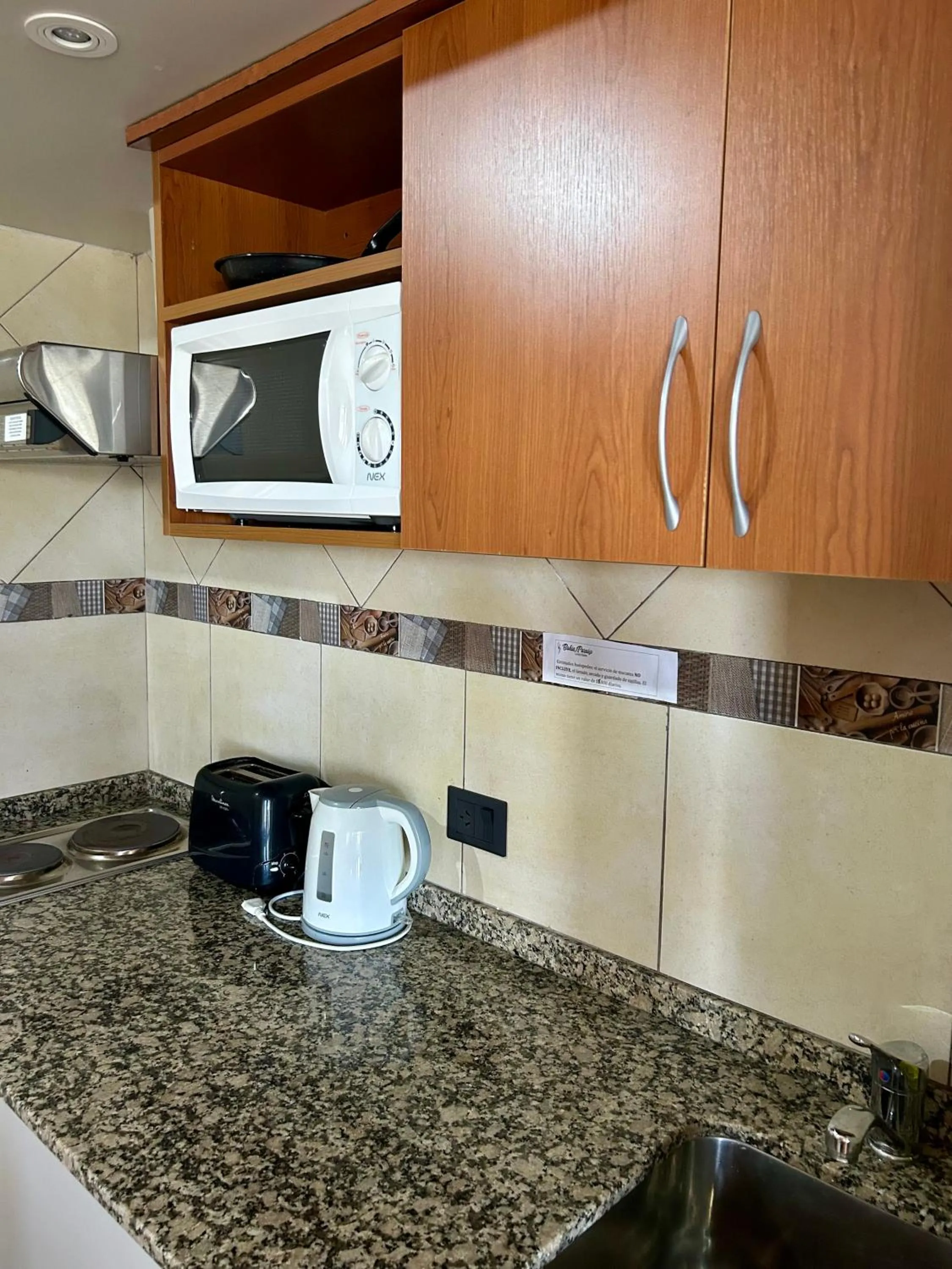 Kitchen or kitchenette in Bahia Paraiso Apart & Suites