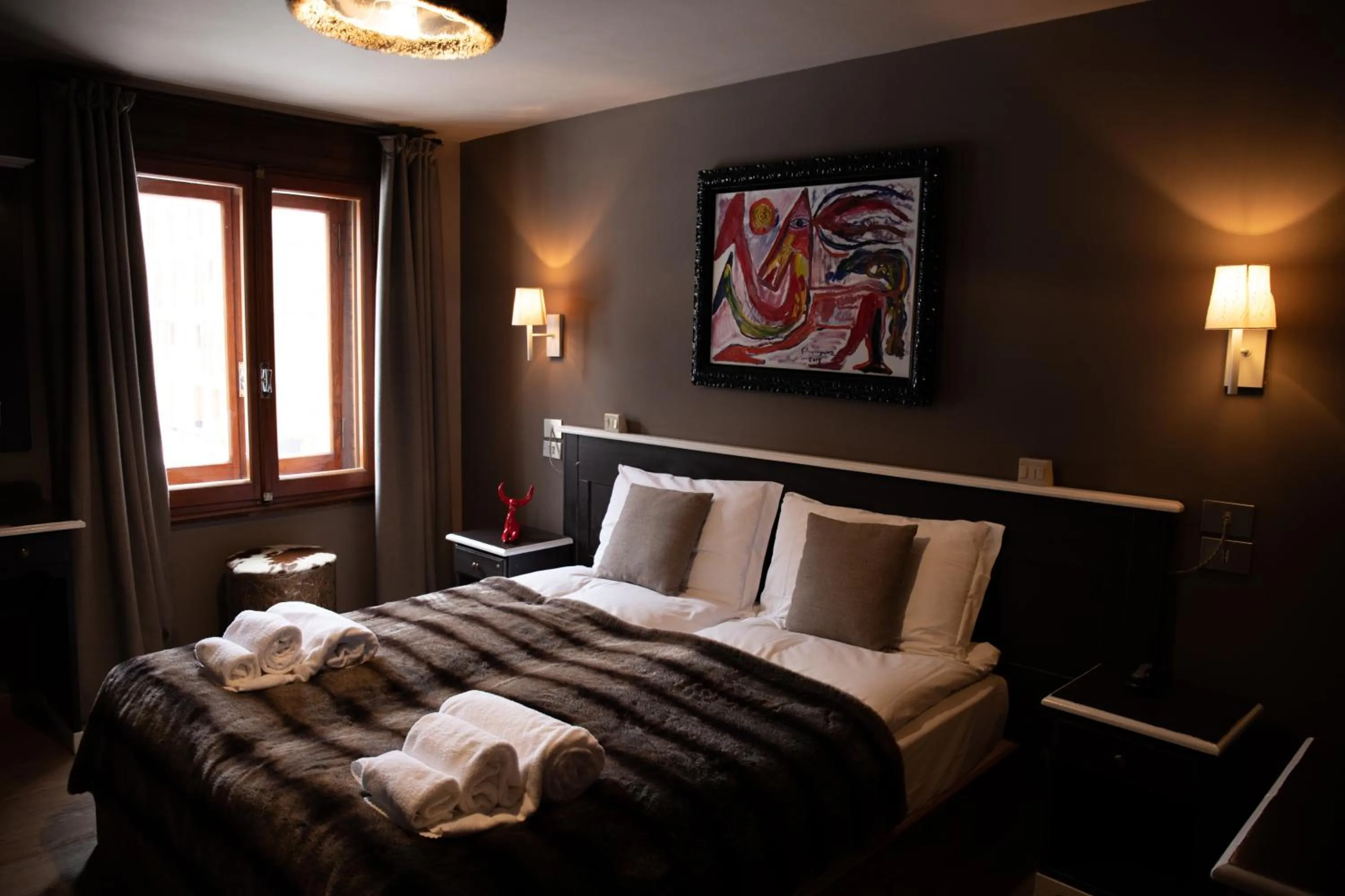 Bed in Art Hotel Grivola