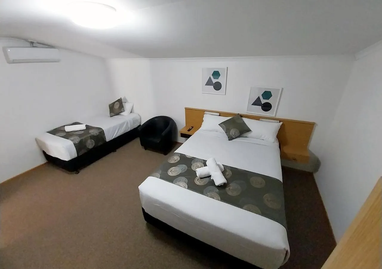 Bed in Blue Shades Motel