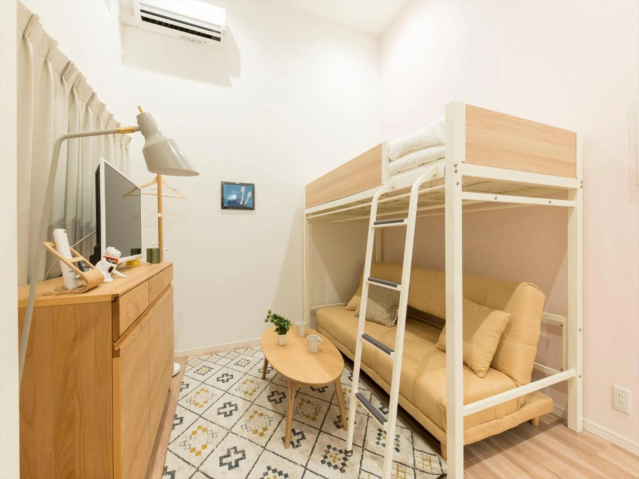 Living room, Bed in TRIP POD SUMIYOSHI C