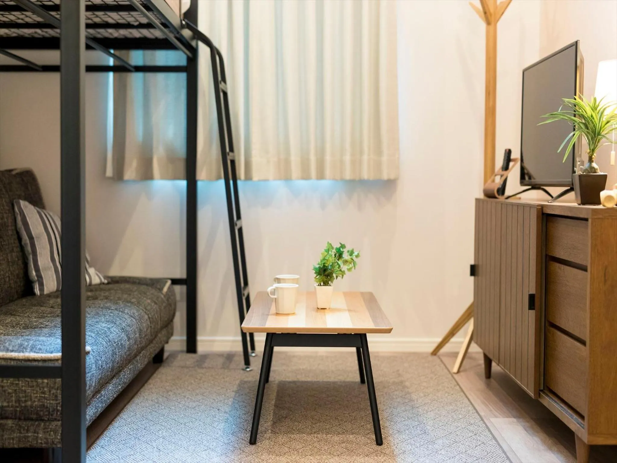 Living room, Bed in TRIP POD TOJIN-MACHI A