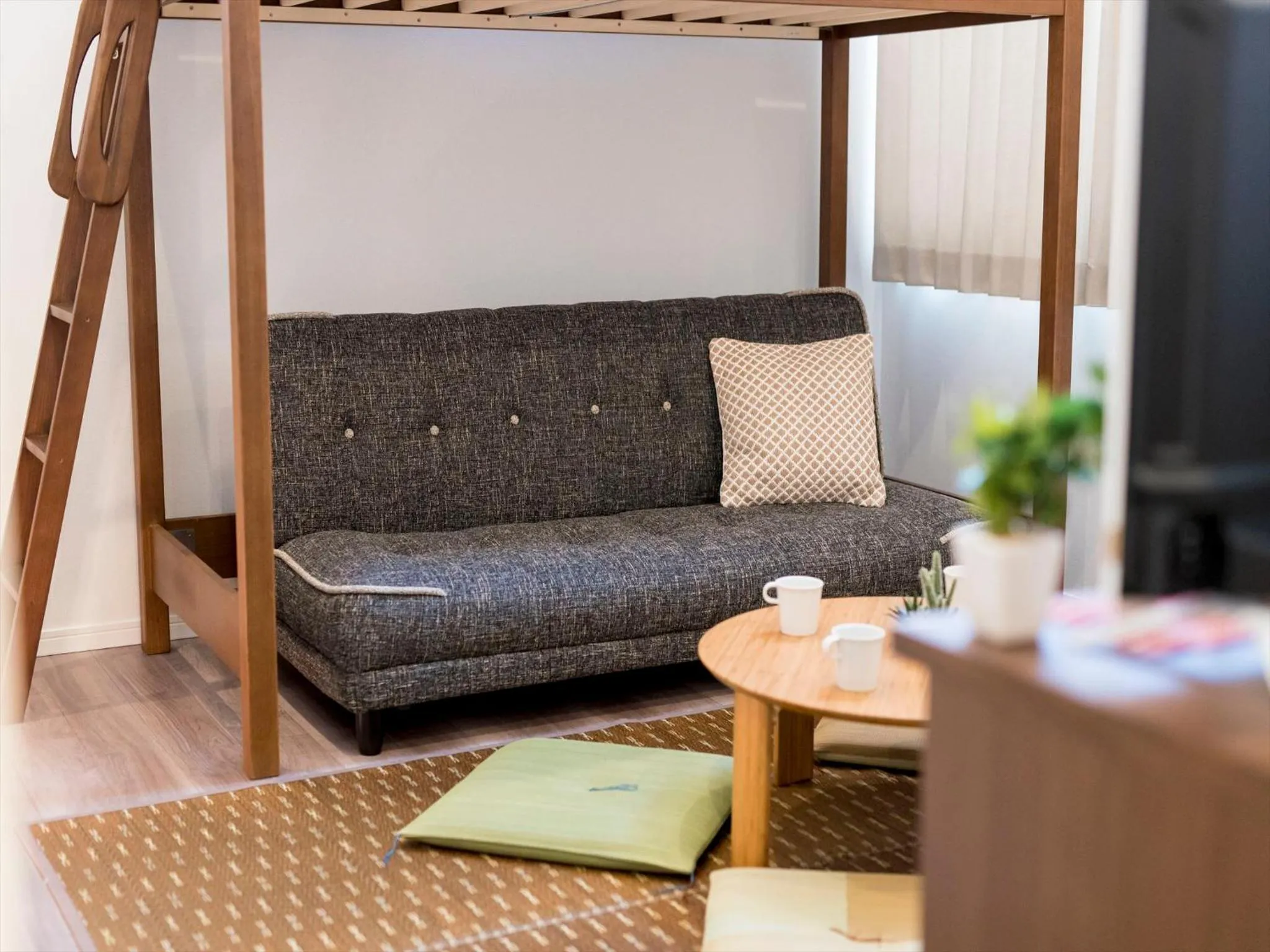 Living room in TRIP POD TOJIN-MACHI A