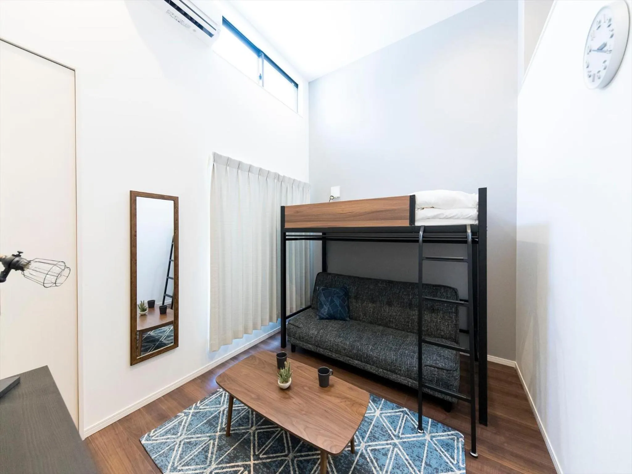 Living room, Bed in TRIP POD SUMIYOSHI A