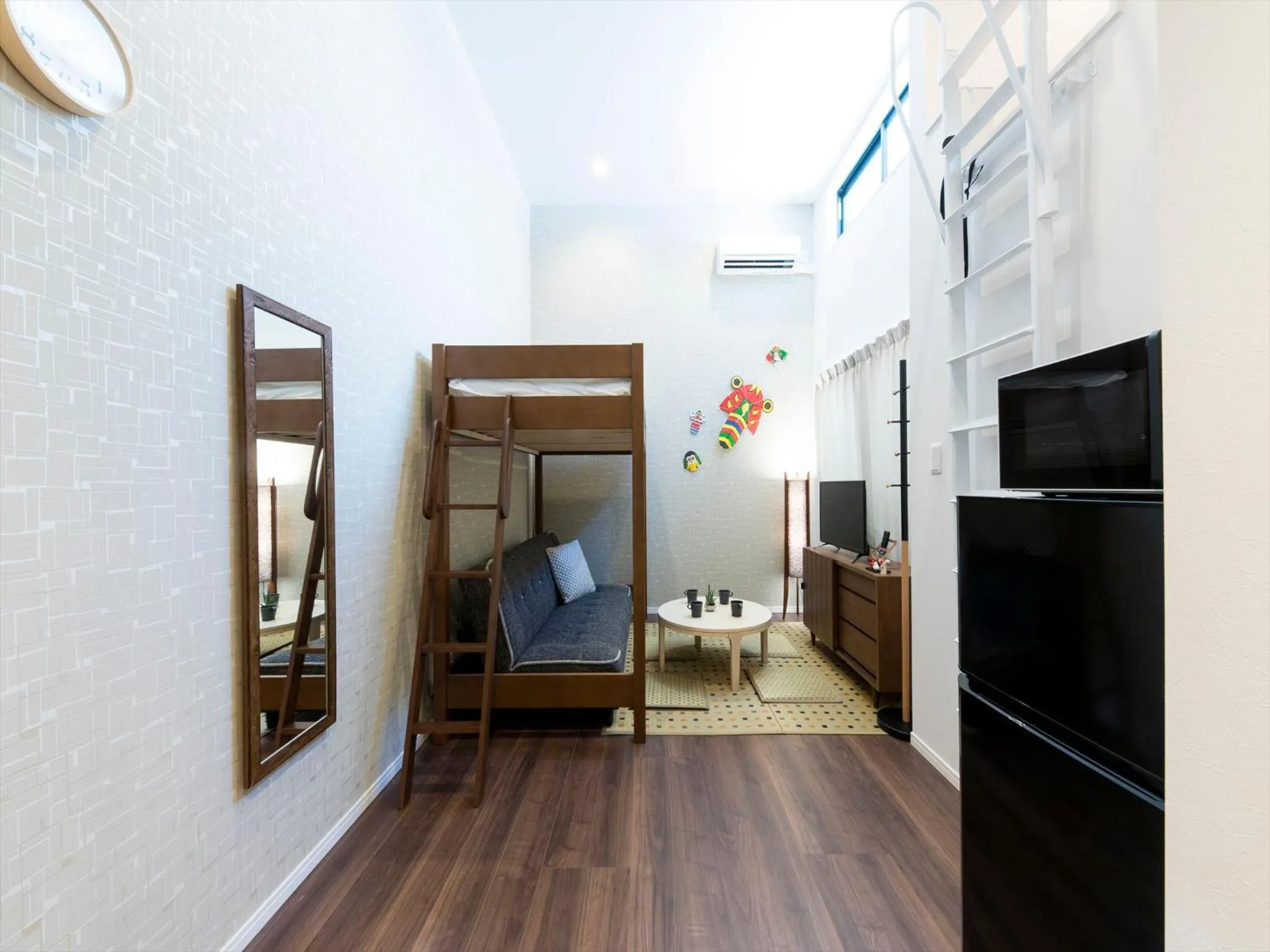 Living room, Bed in TRIP POD SUMIYOSHI A