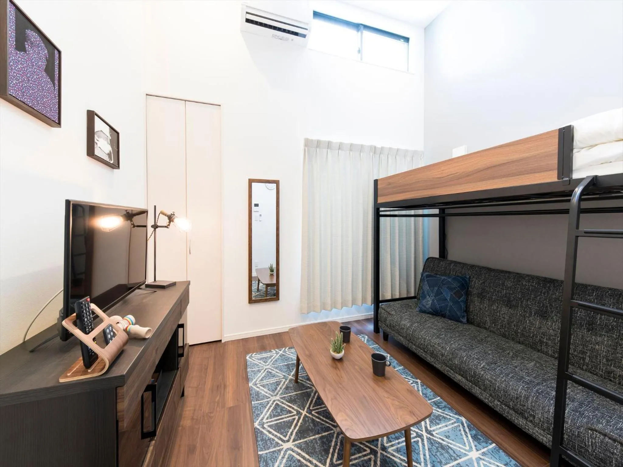 Living room, Bed in TRIP POD SUMIYOSHI A