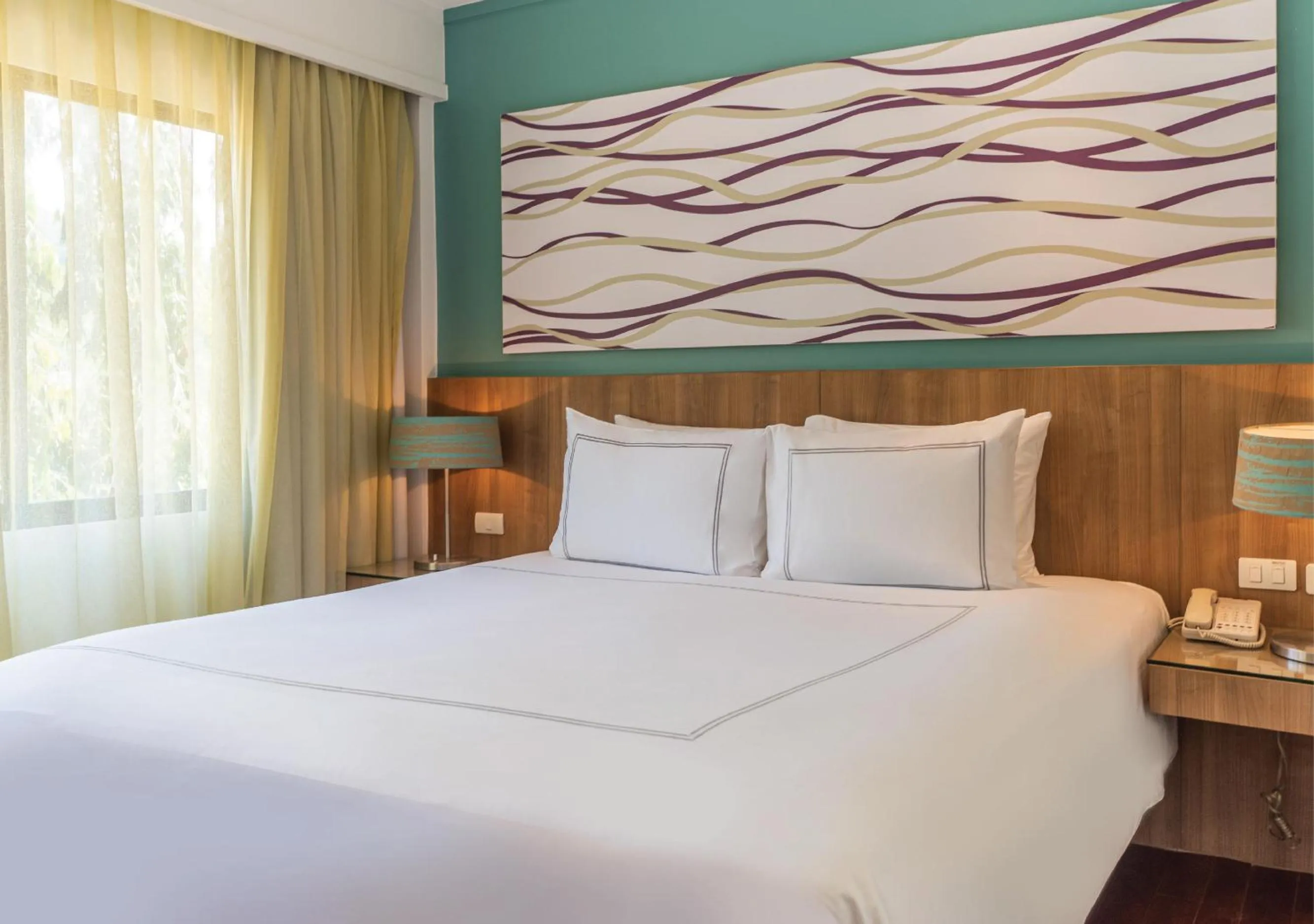 Bed in Radisson Resort and Suites Phuket