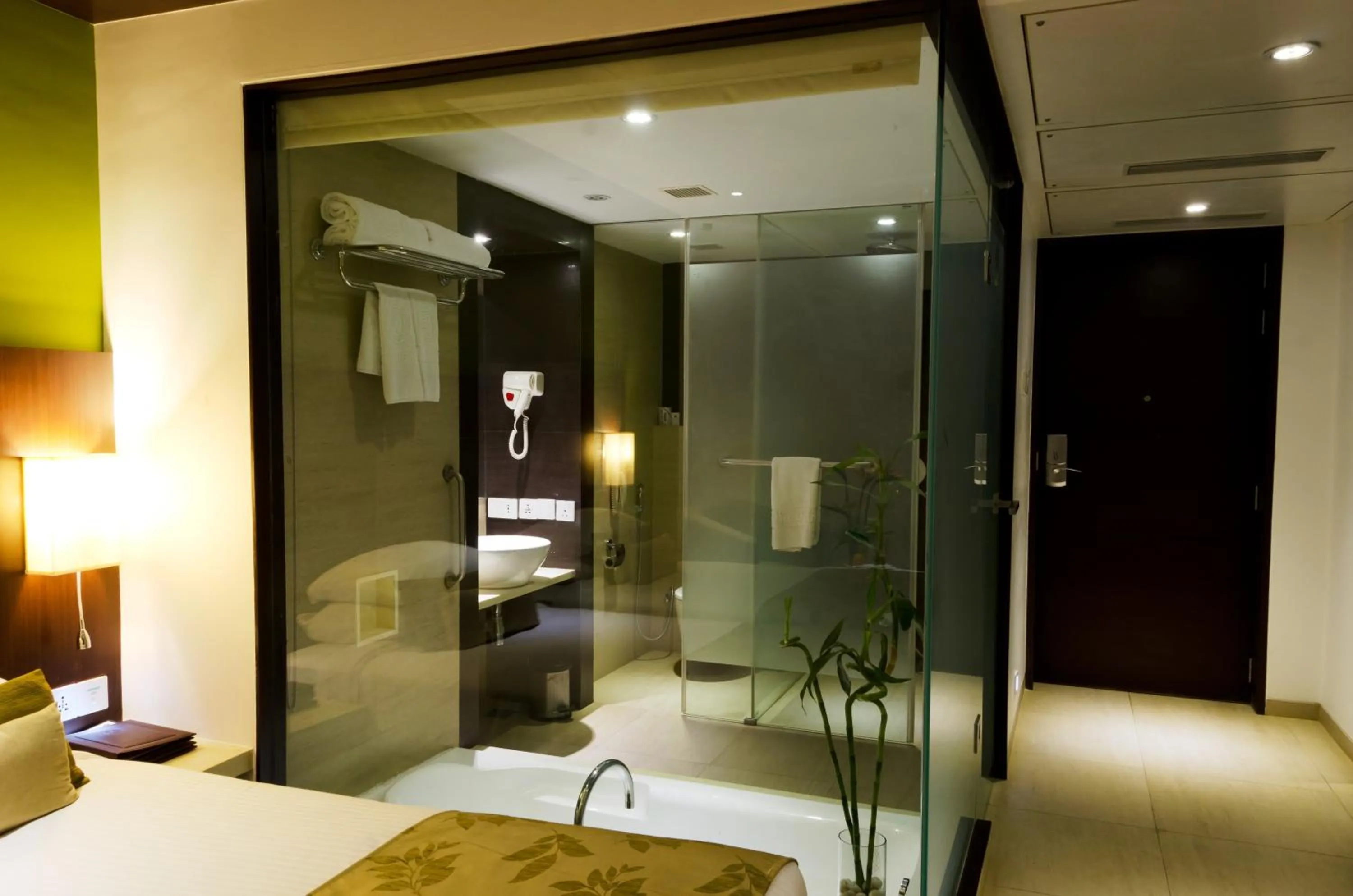 Bathroom, Bed in Ramee Grand Hotel and Spa, Pune