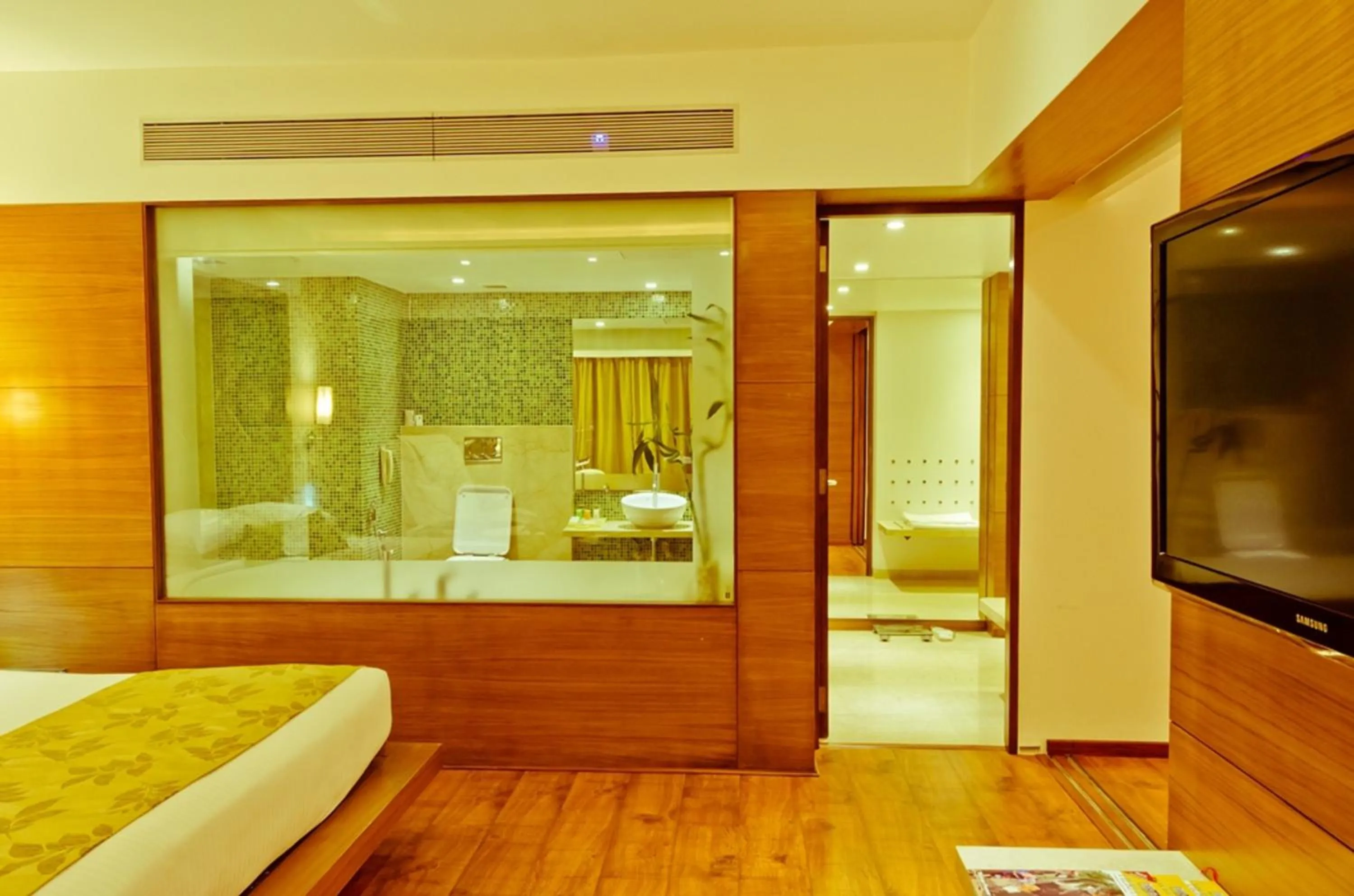 Bathroom, Bed in Ramee Grand Hotel and Spa, Pune