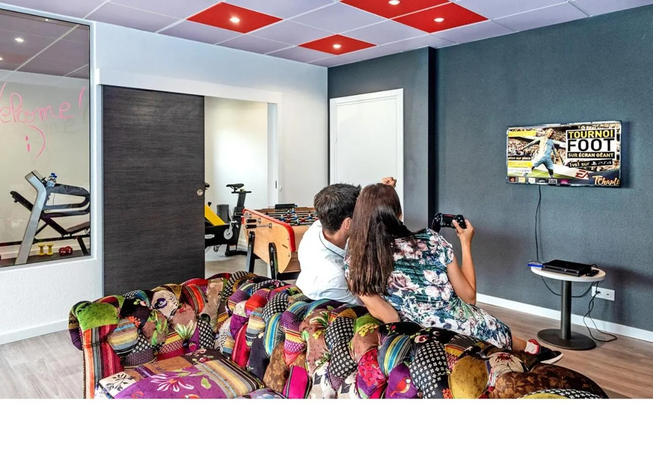 Communal lounge/ TV room in ibis budget Strasbourg Sud Illkirch