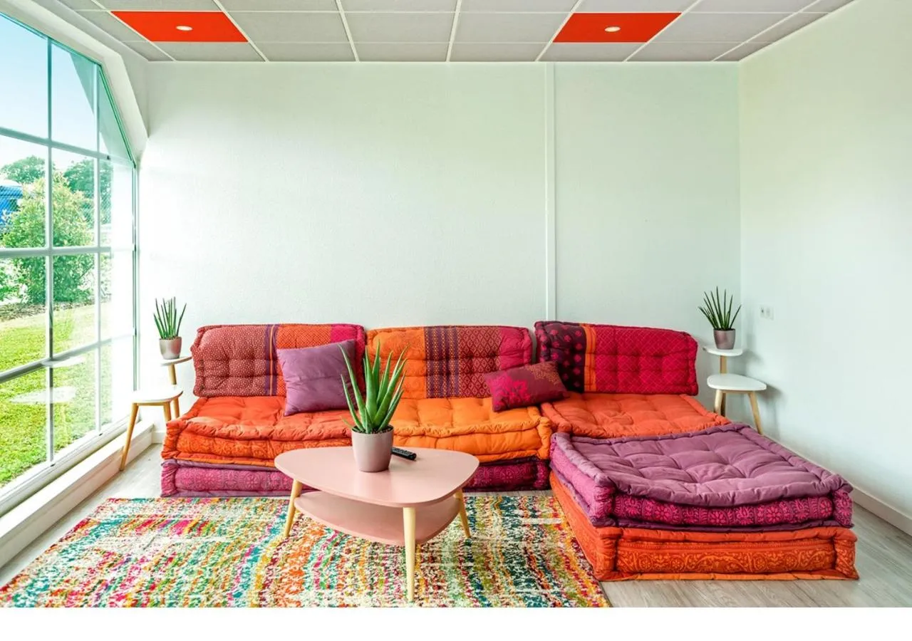 Communal lounge/ TV room in ibis budget Strasbourg Sud Illkirch