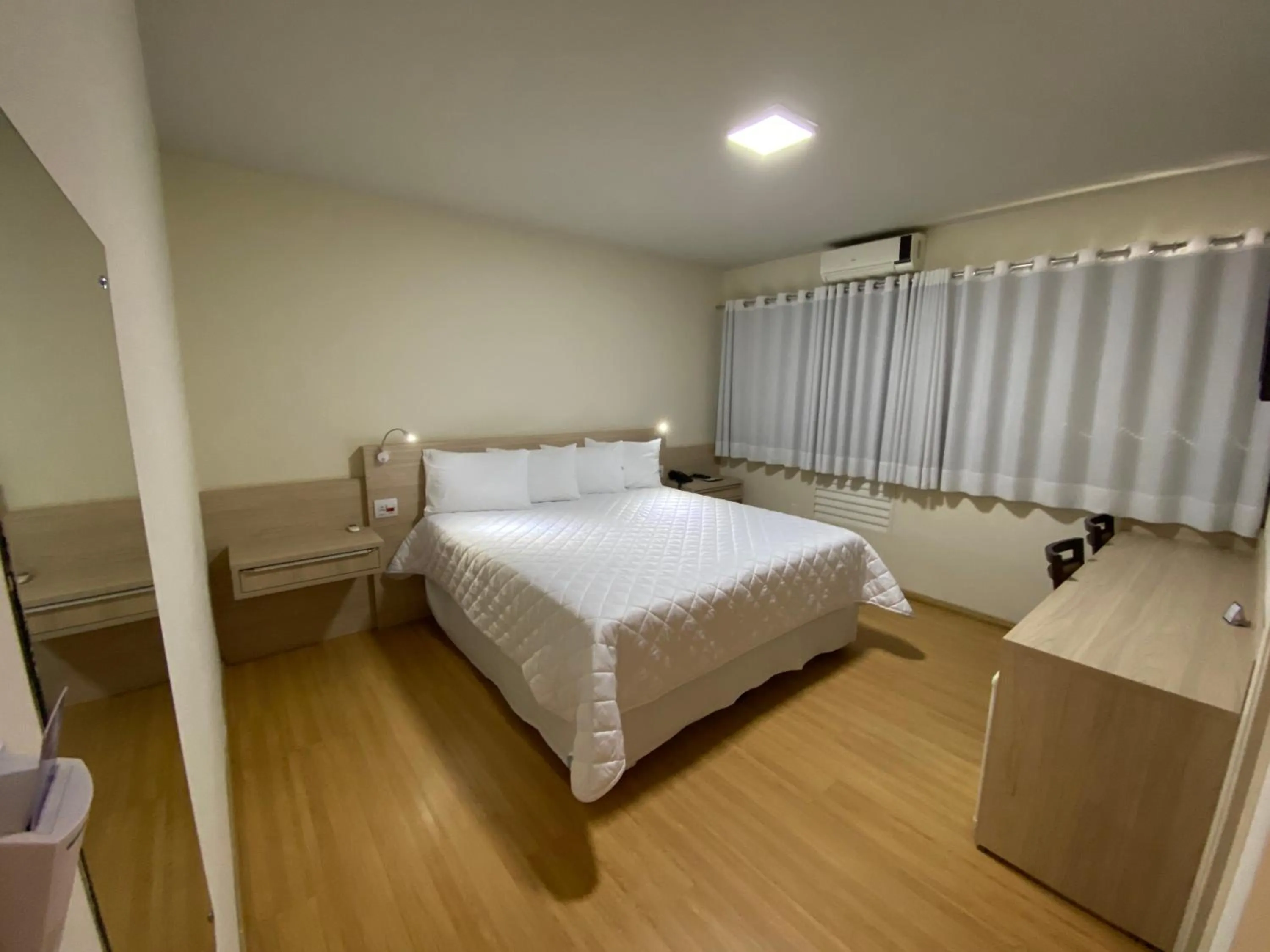 Bed in HD Plaza Hotel