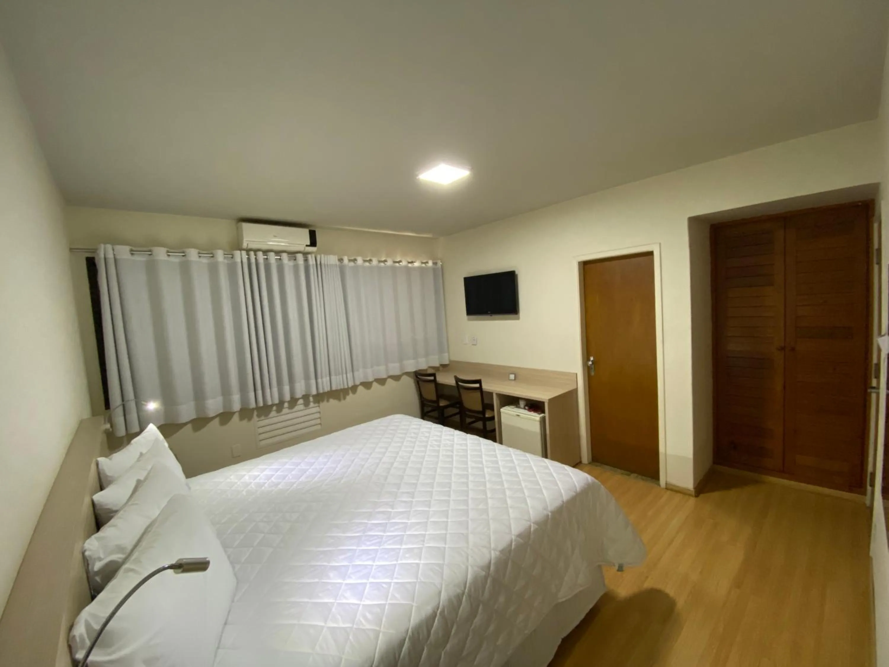 Bed in HD Plaza Hotel