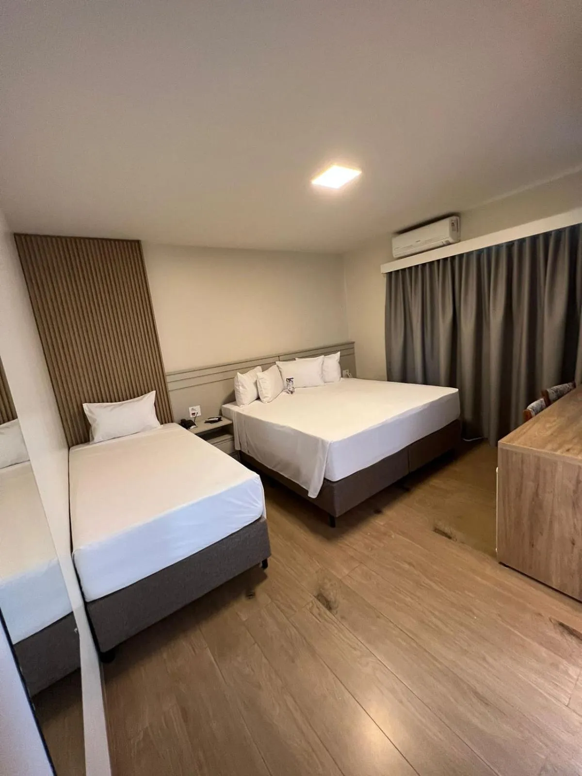 Bed in HD Plaza Hotel