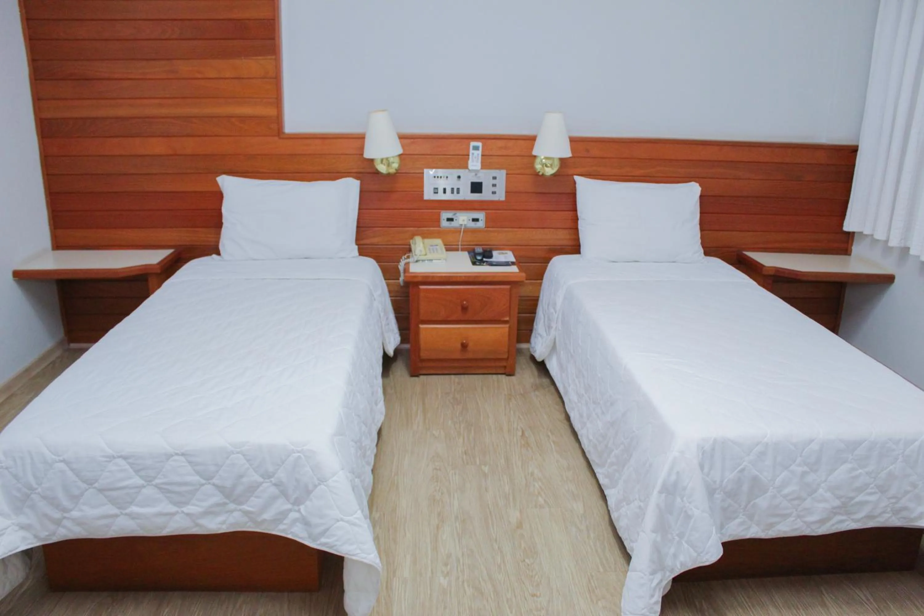 Bed in HD Plaza Hotel