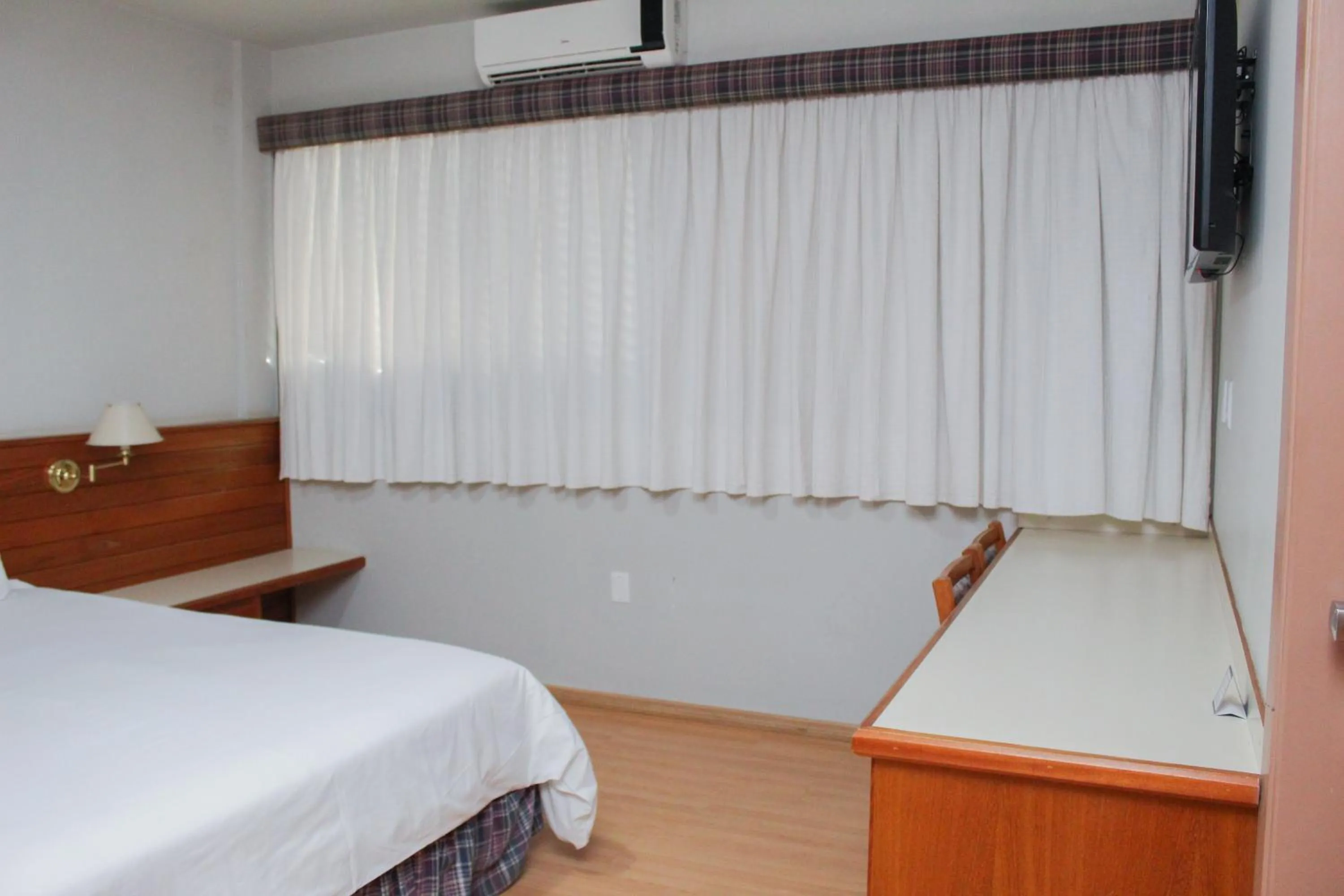 Bed in HD Plaza Hotel