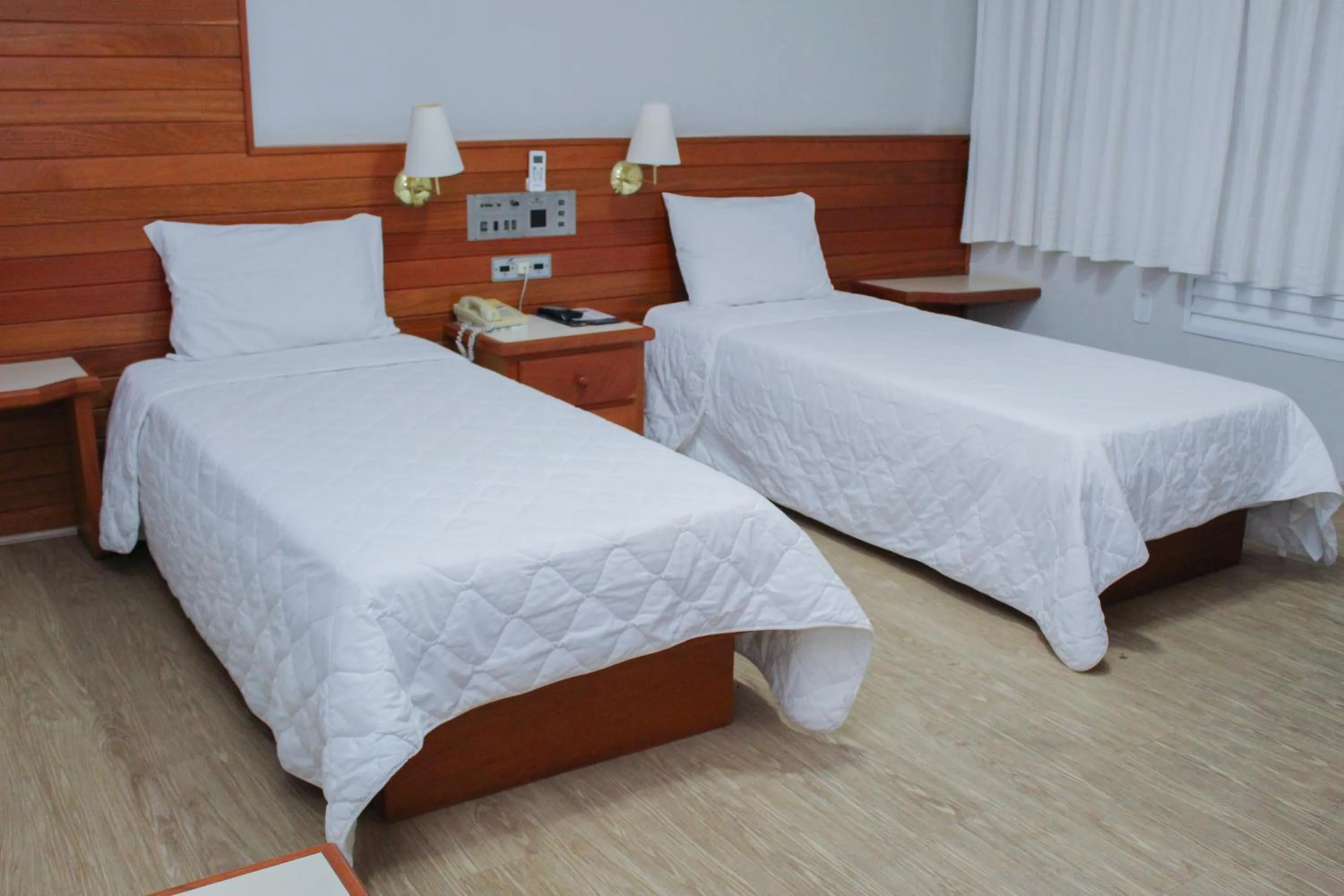 Bed in HD Plaza Hotel