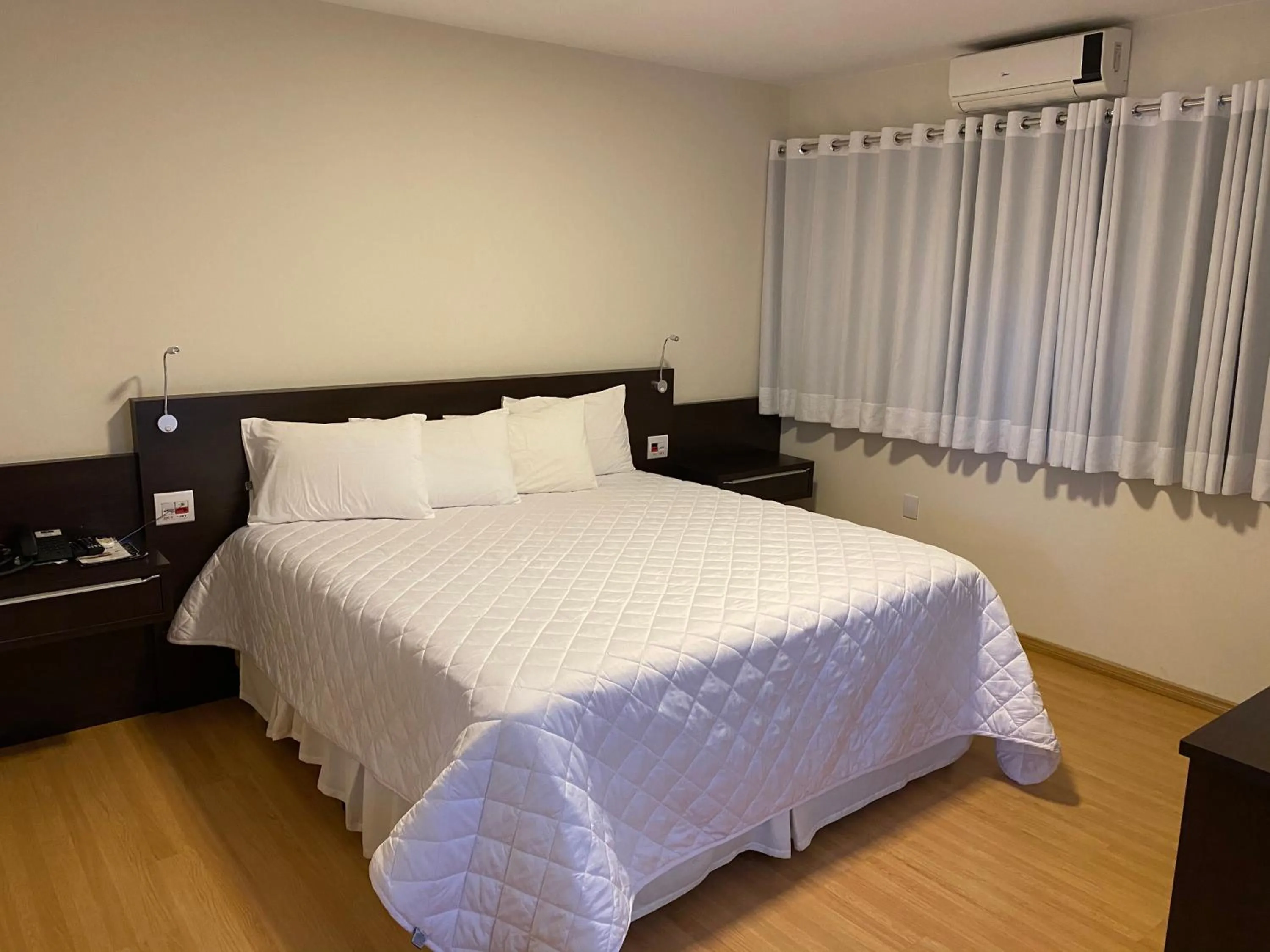 Bed in HD Plaza Hotel