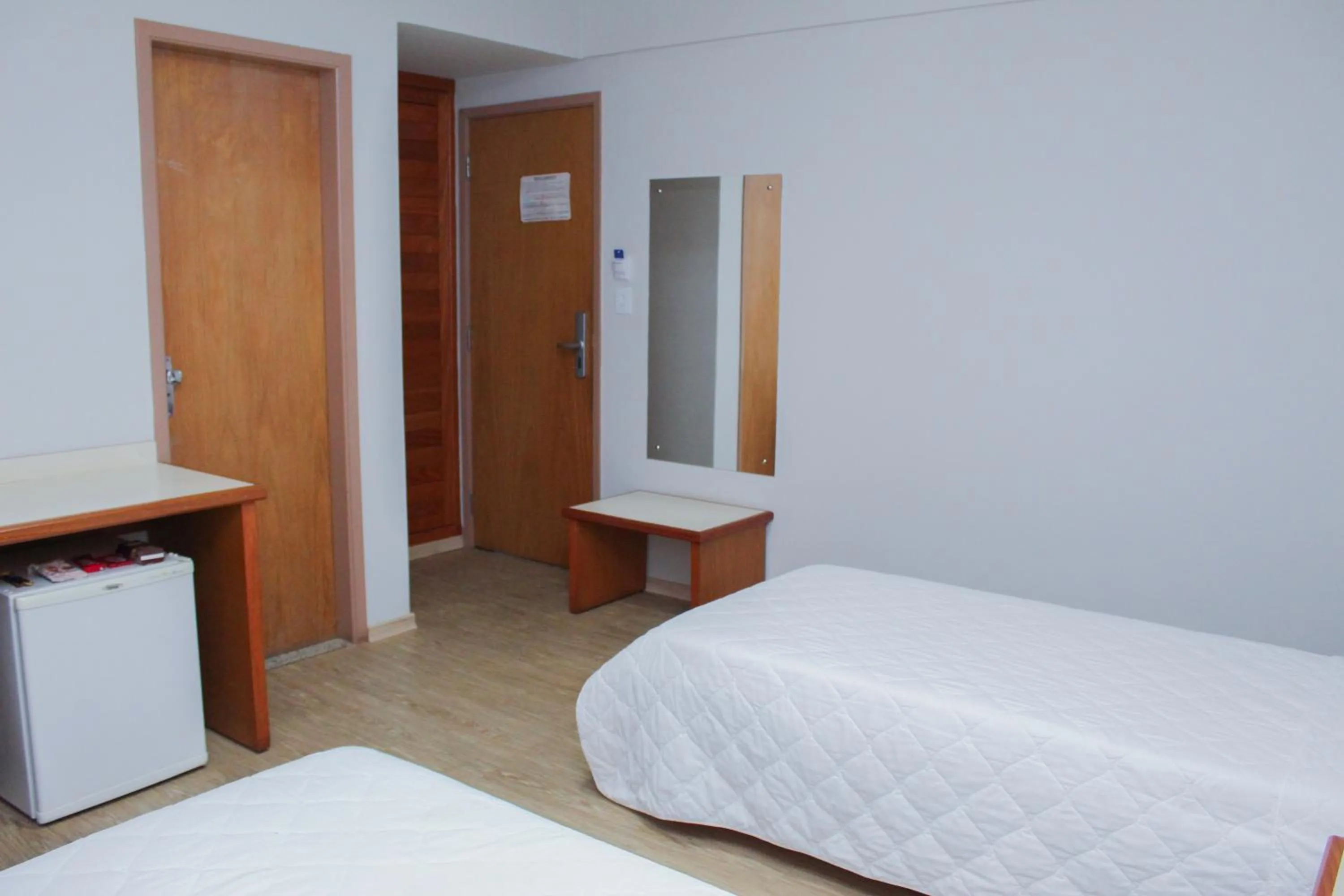 Bed in HD Plaza Hotel