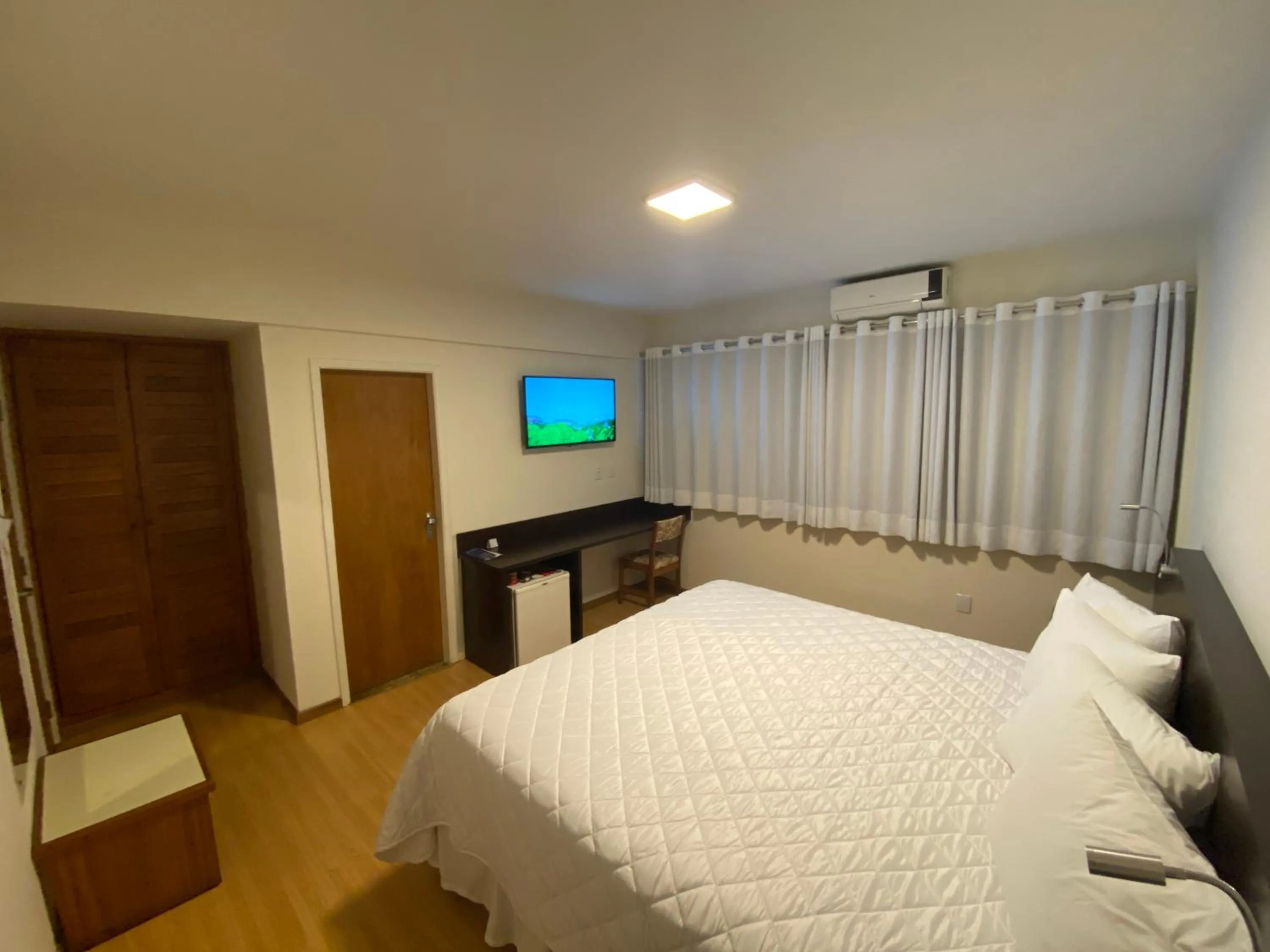 Bed in HD Plaza Hotel