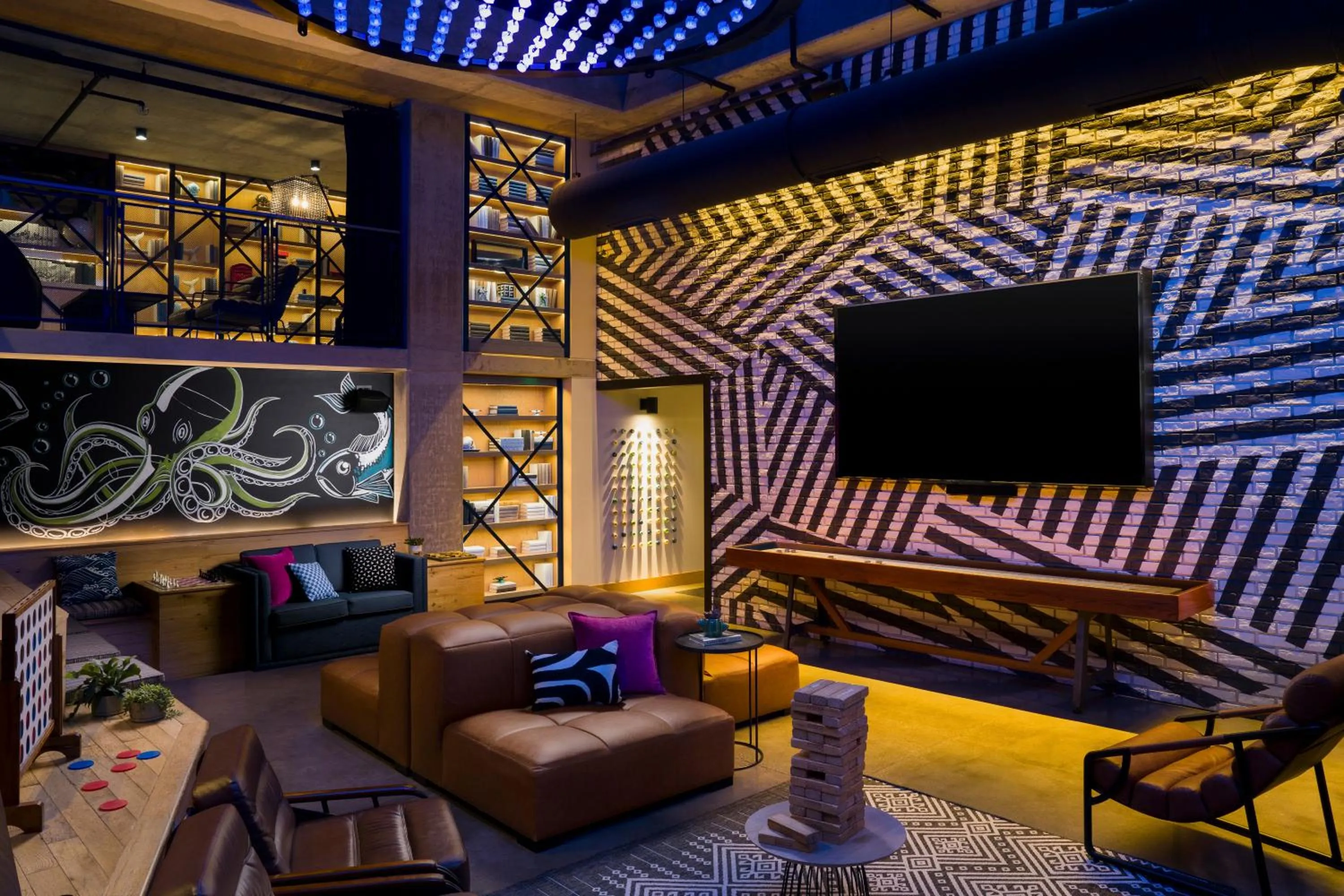 Communal lounge/ TV room in Moxy San Diego Gaslamp Quarter