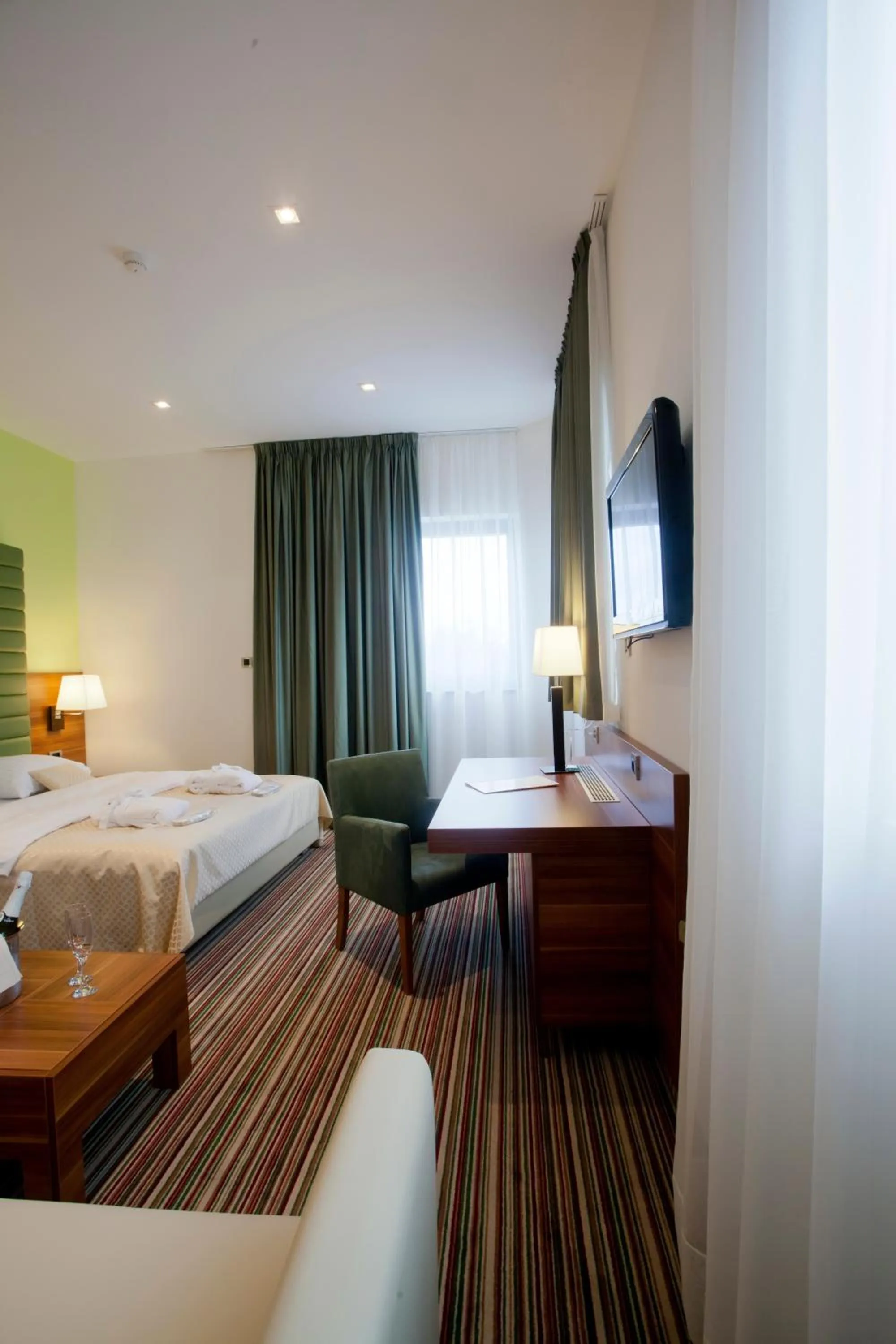 Seating area, Bed in Hotel Sport