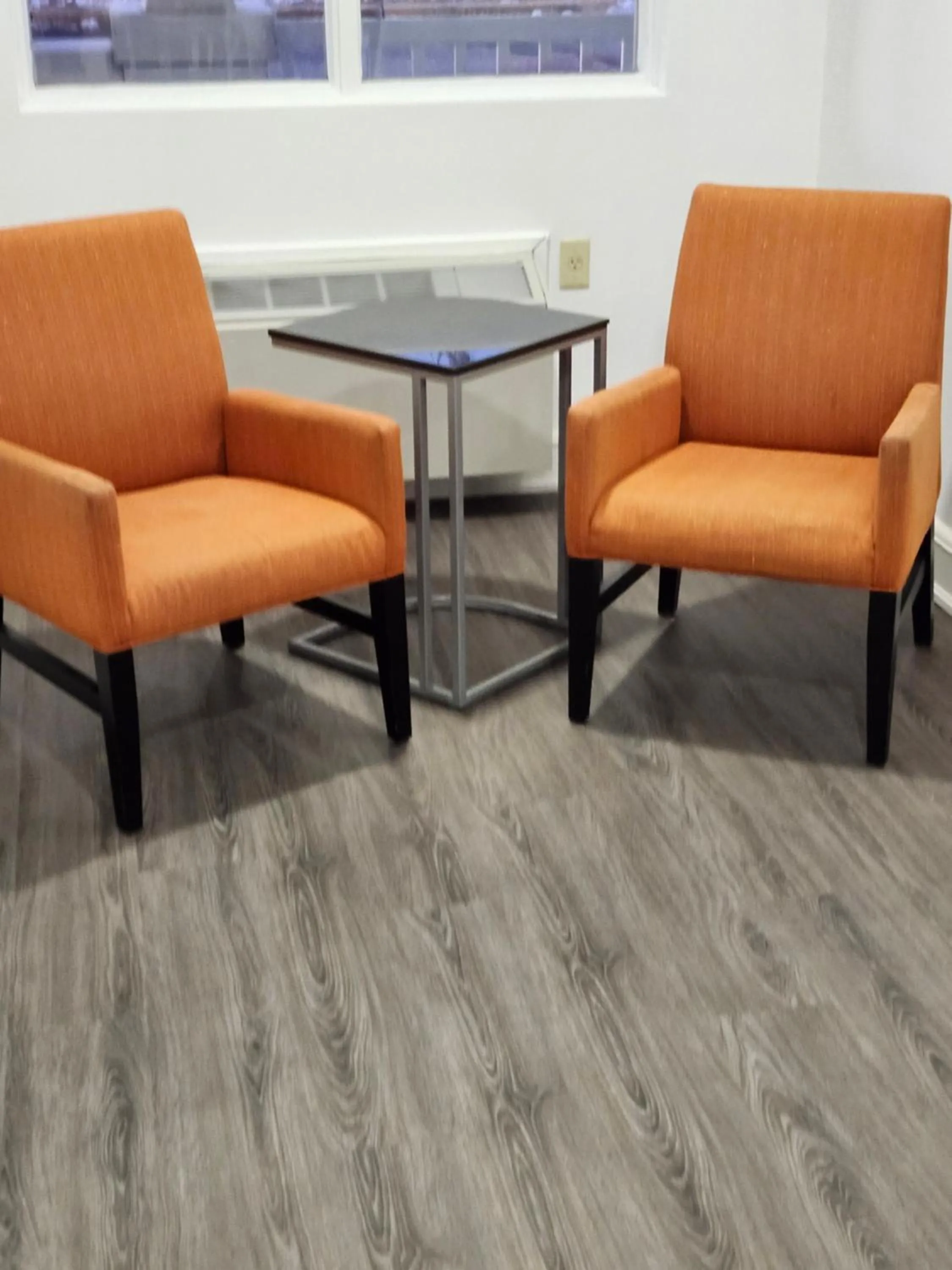 Seating area in Travelodge Suites by Wyndham Saint John