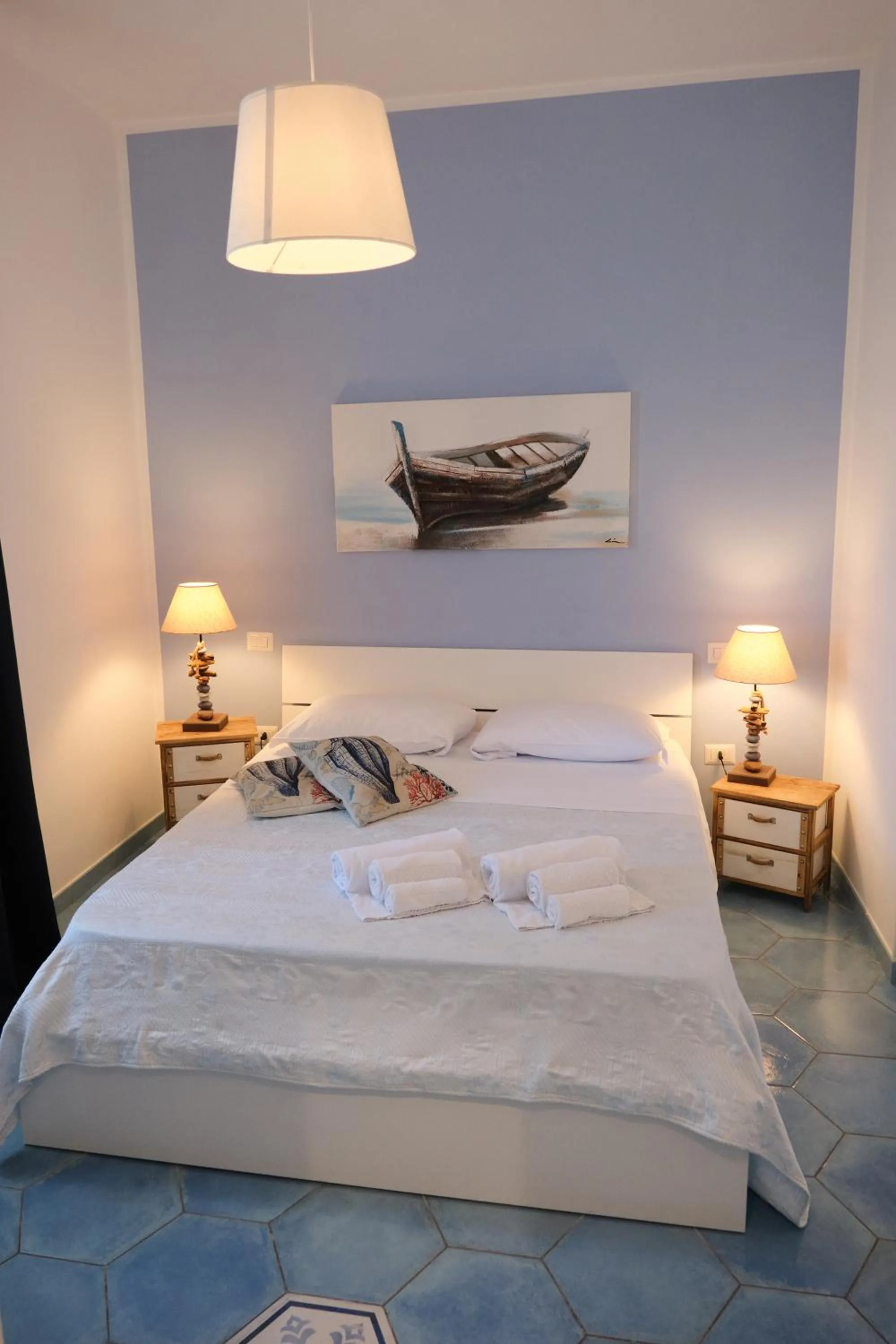 Bed in Pharus Miseni Suites and rooms