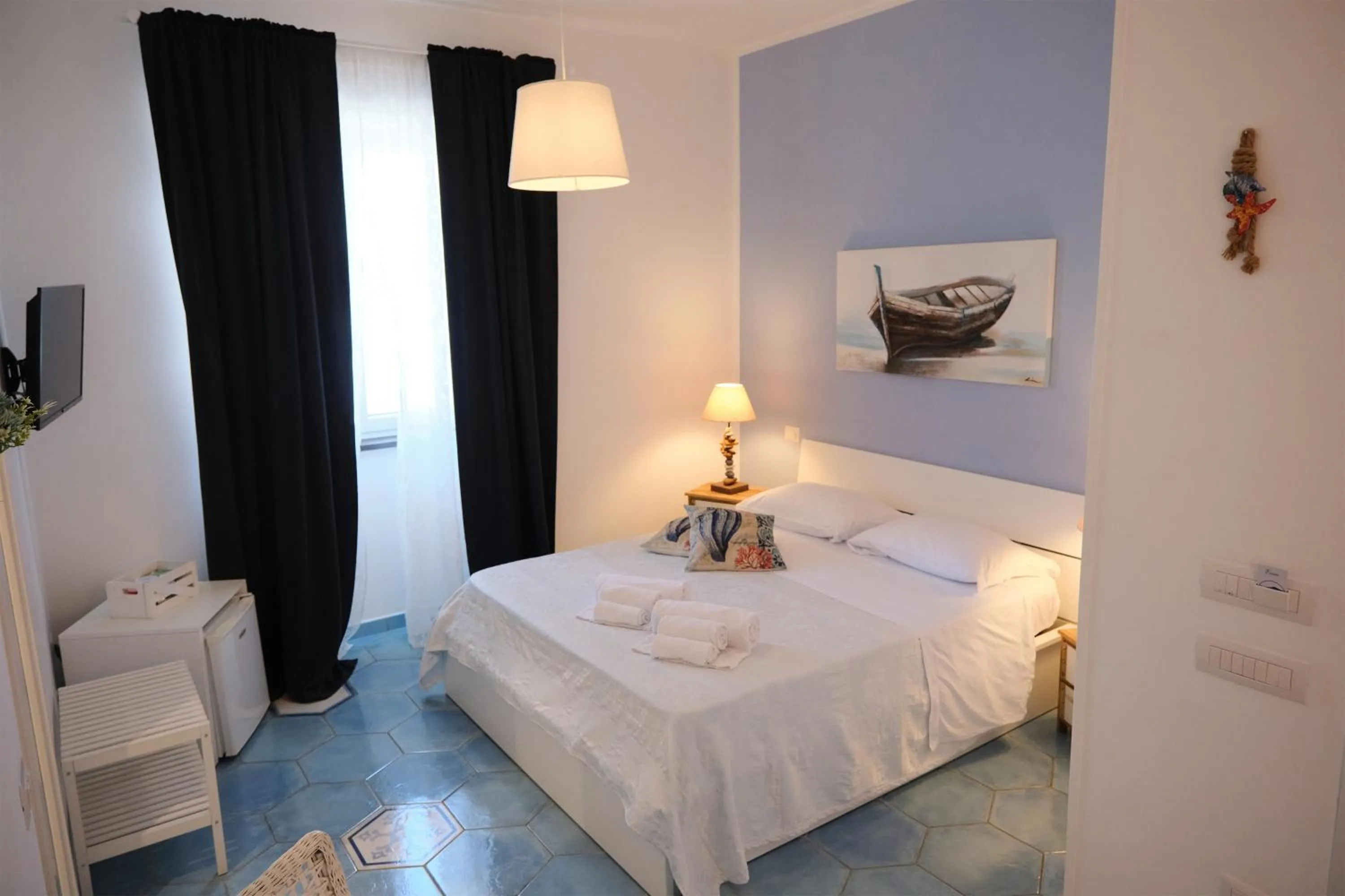 Bed in Pharus Miseni Suites and rooms